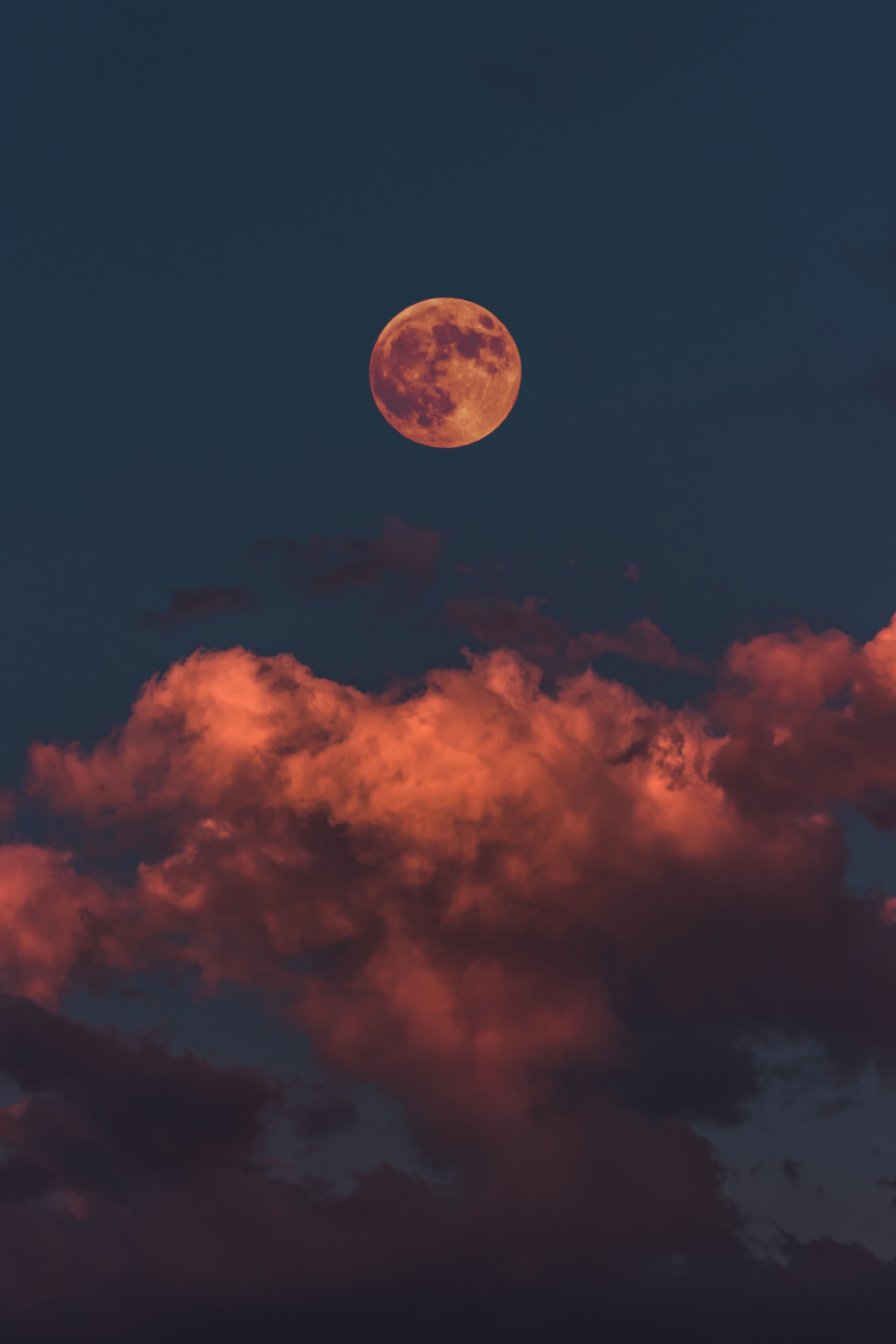 Full moon rising above orange clouds at dusk HD Phone Wallpaper