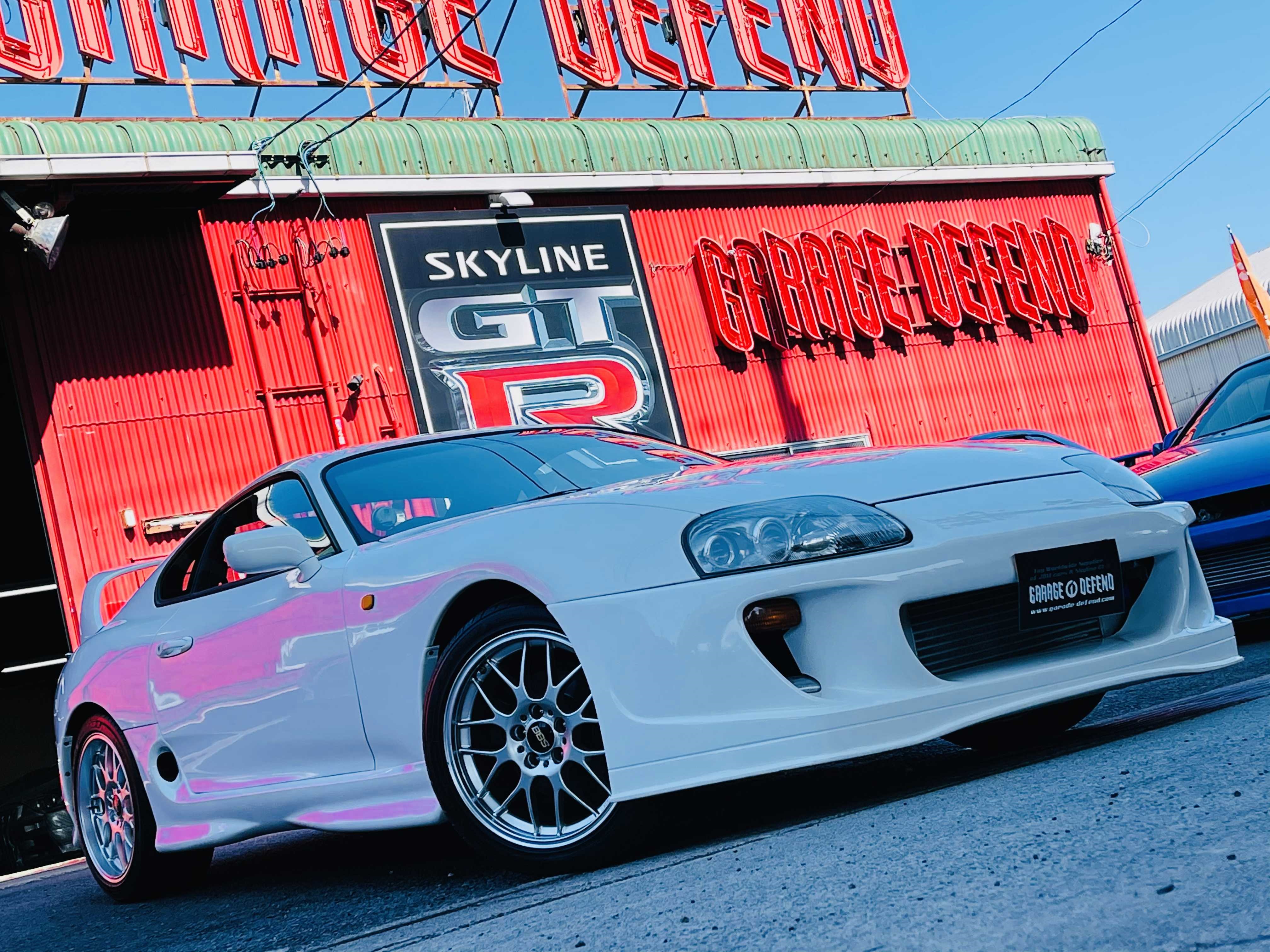 White Toyota Supra RZ at Garage Defend HD Wallpaper
