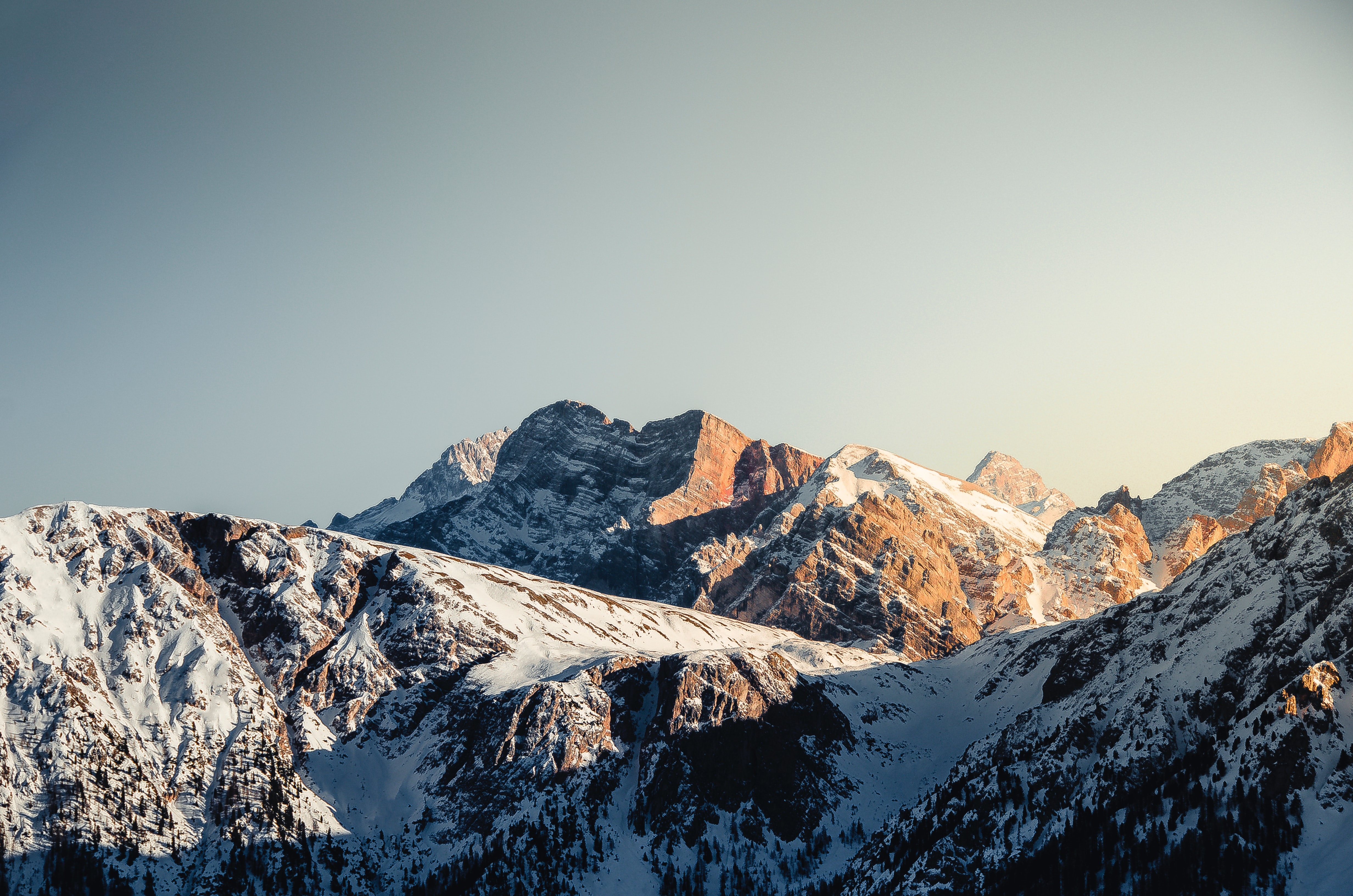 4K snow-covered mountains with forest HD Wallpaper