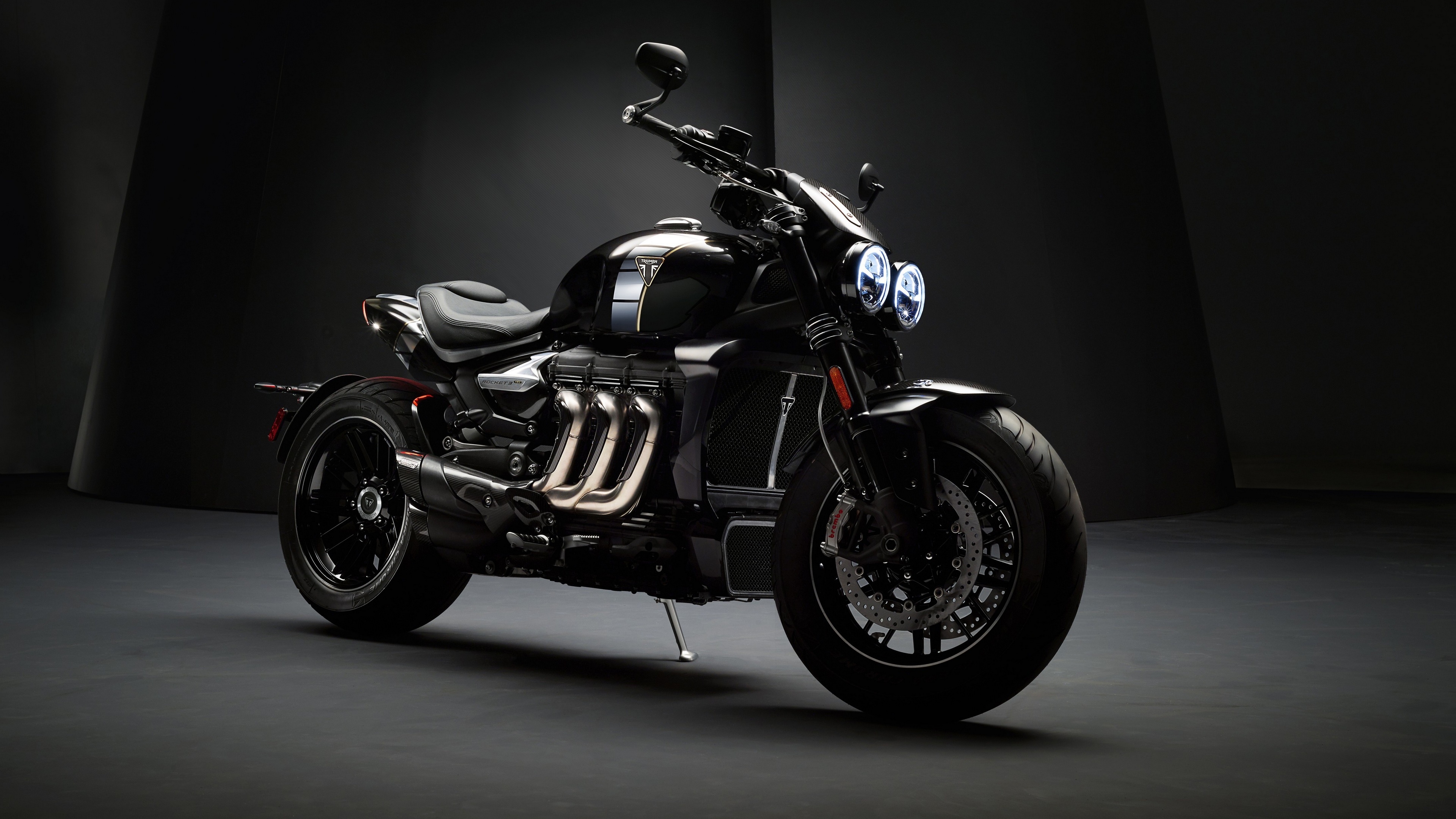 4K Triumph motorcycle on dark background HD Wallpaper