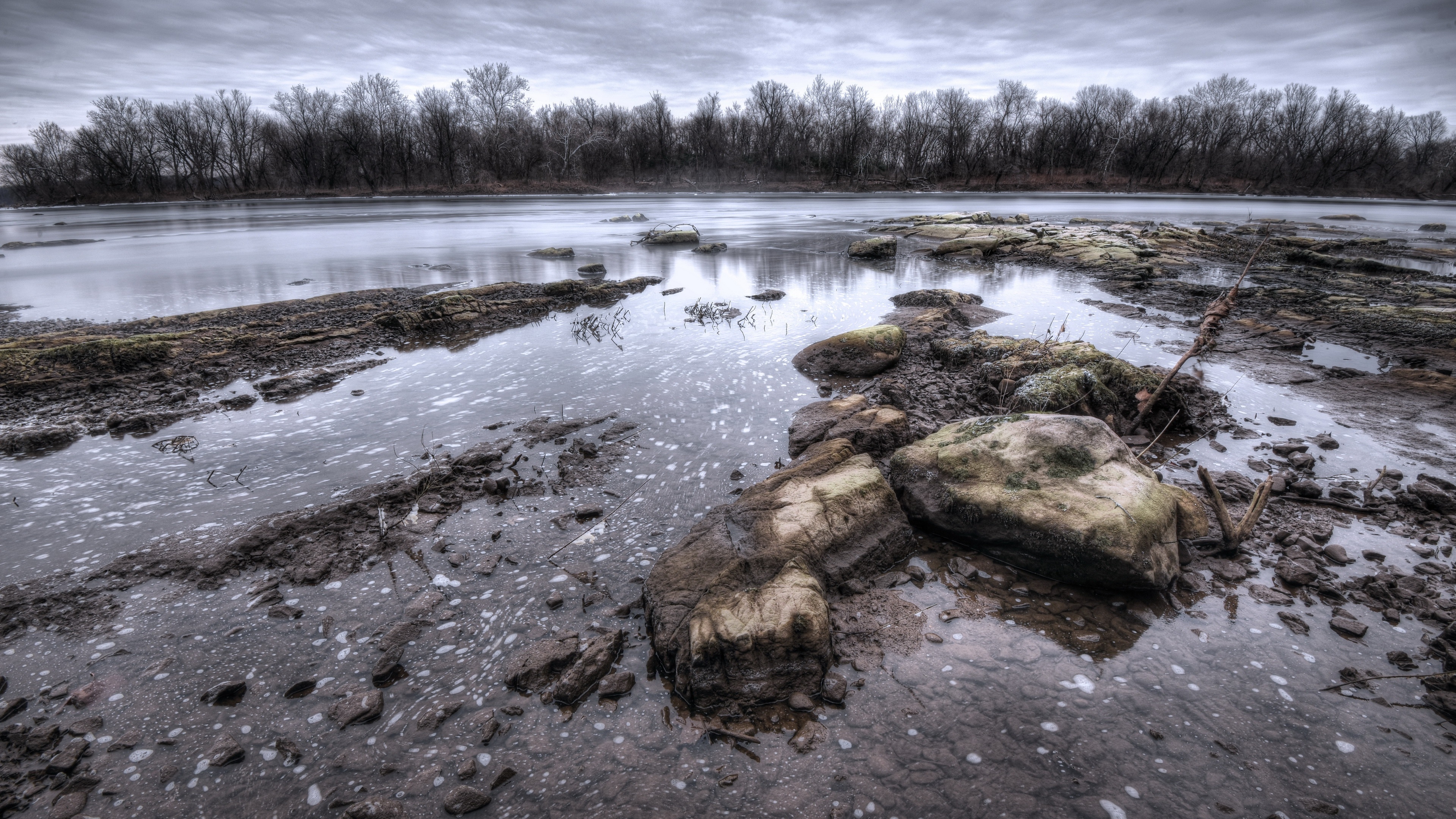 Stones and water in a natural landscape HD Wallpaper
