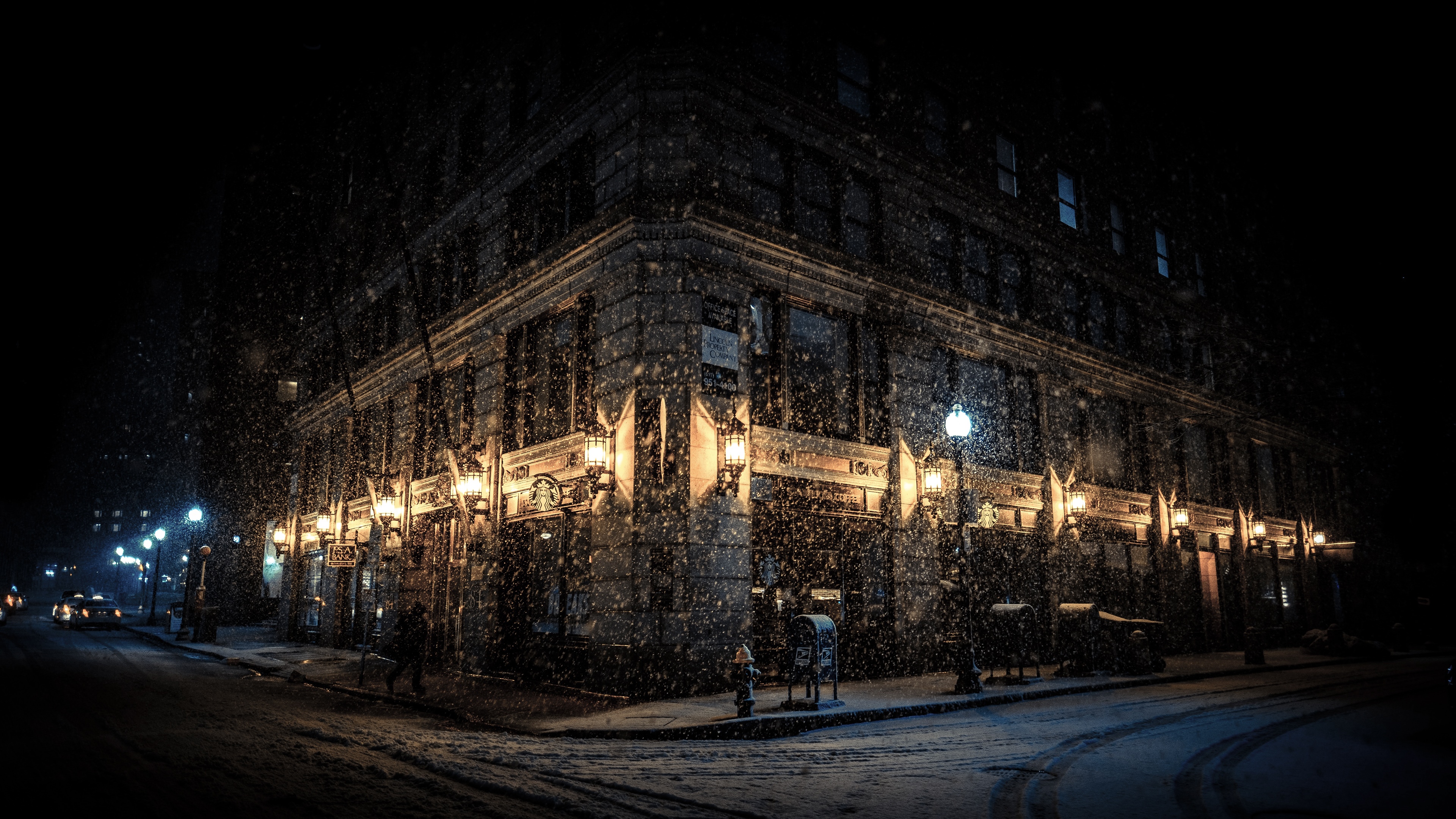 4K snowing night street with building lights HD Wallpaper
