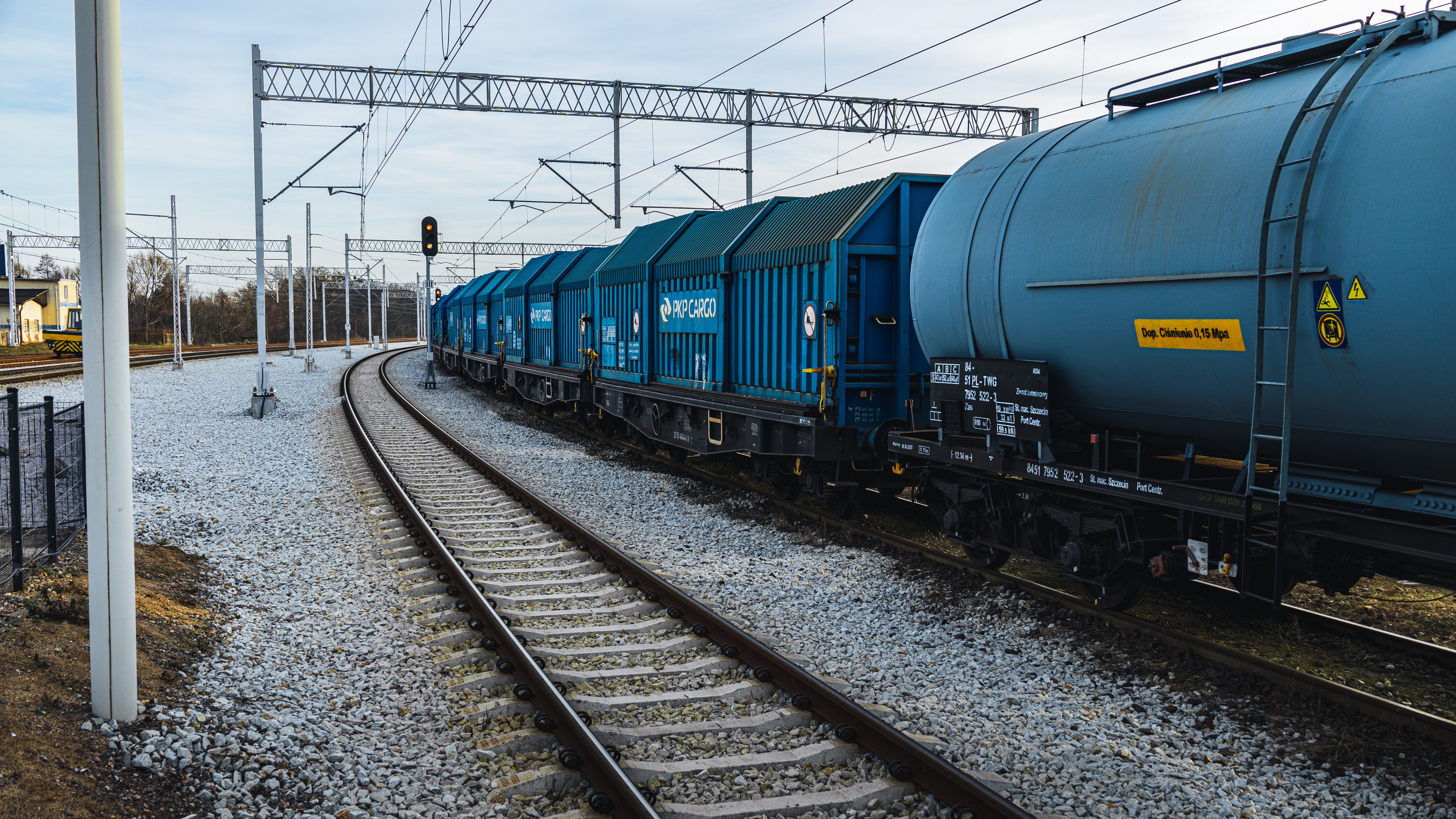 Blue cargo train on railway tracks HD Wallpaper