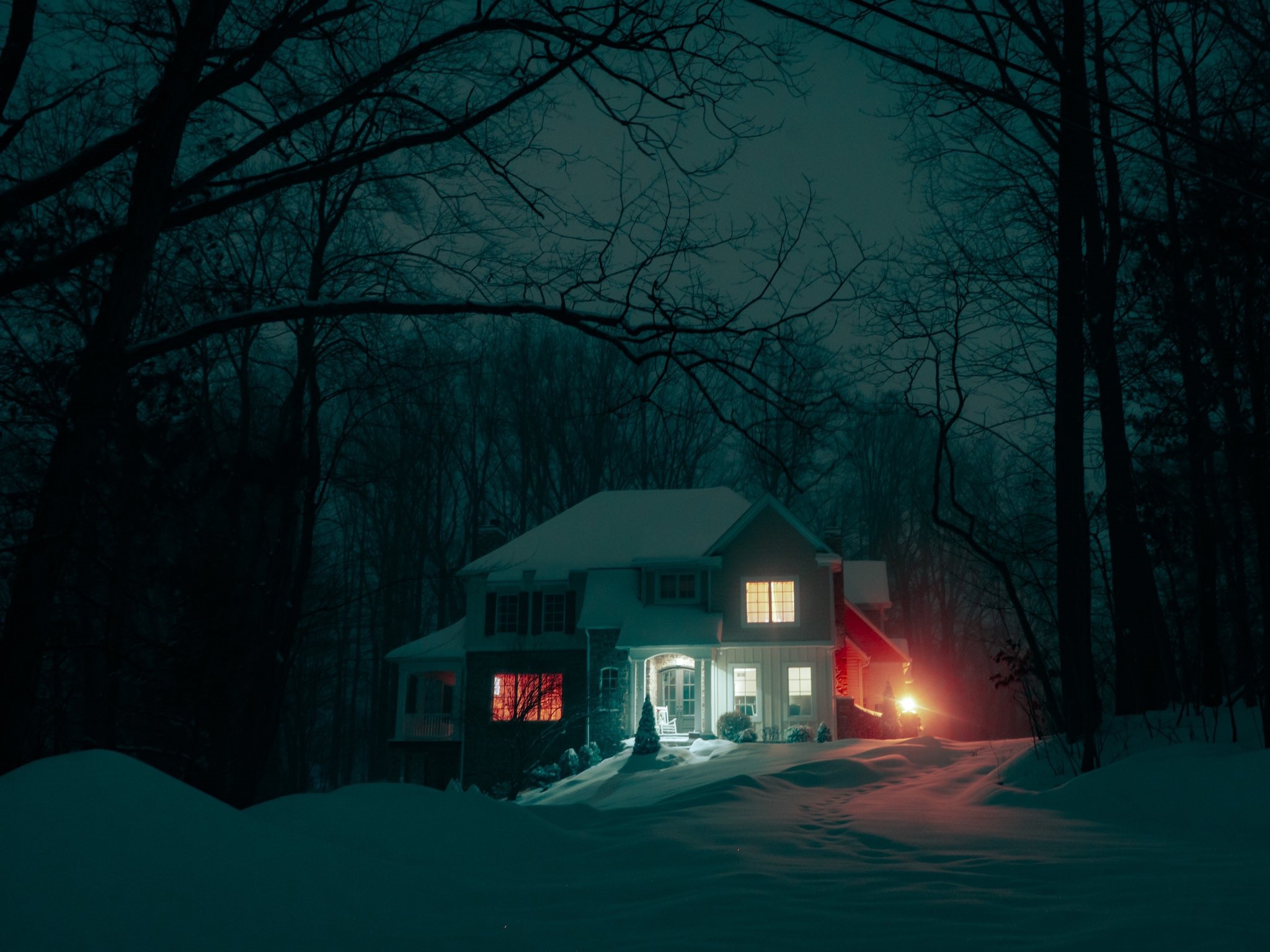 A house in the snow at night HD Wallpaper