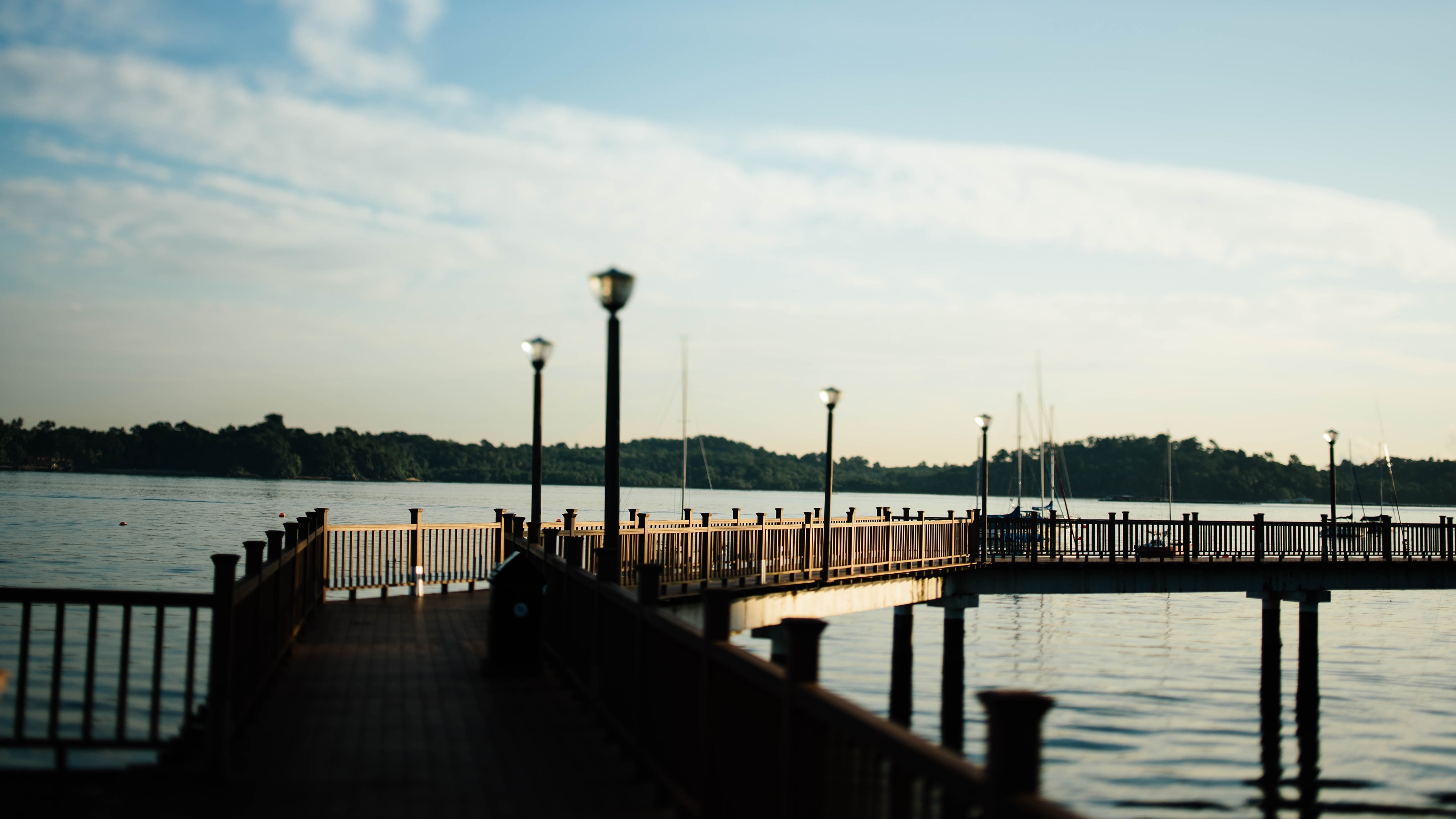 4K Pier with Lamp Posts Overlooking a Lake HD Wallpaper