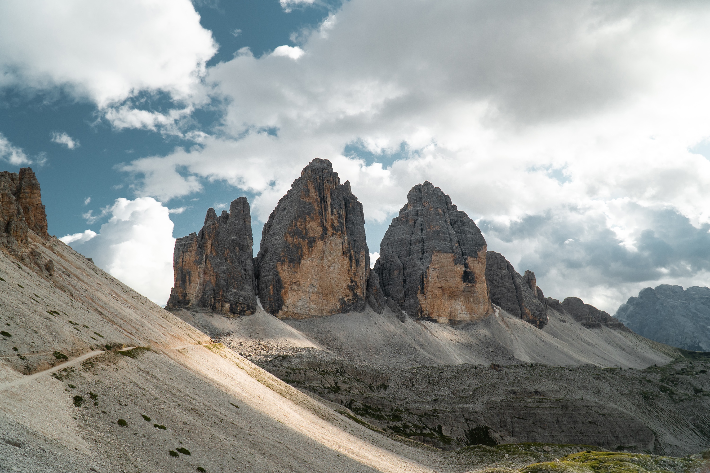 Tre Cime di Lavaredo mountains under cloudy sky HD Wallpaper