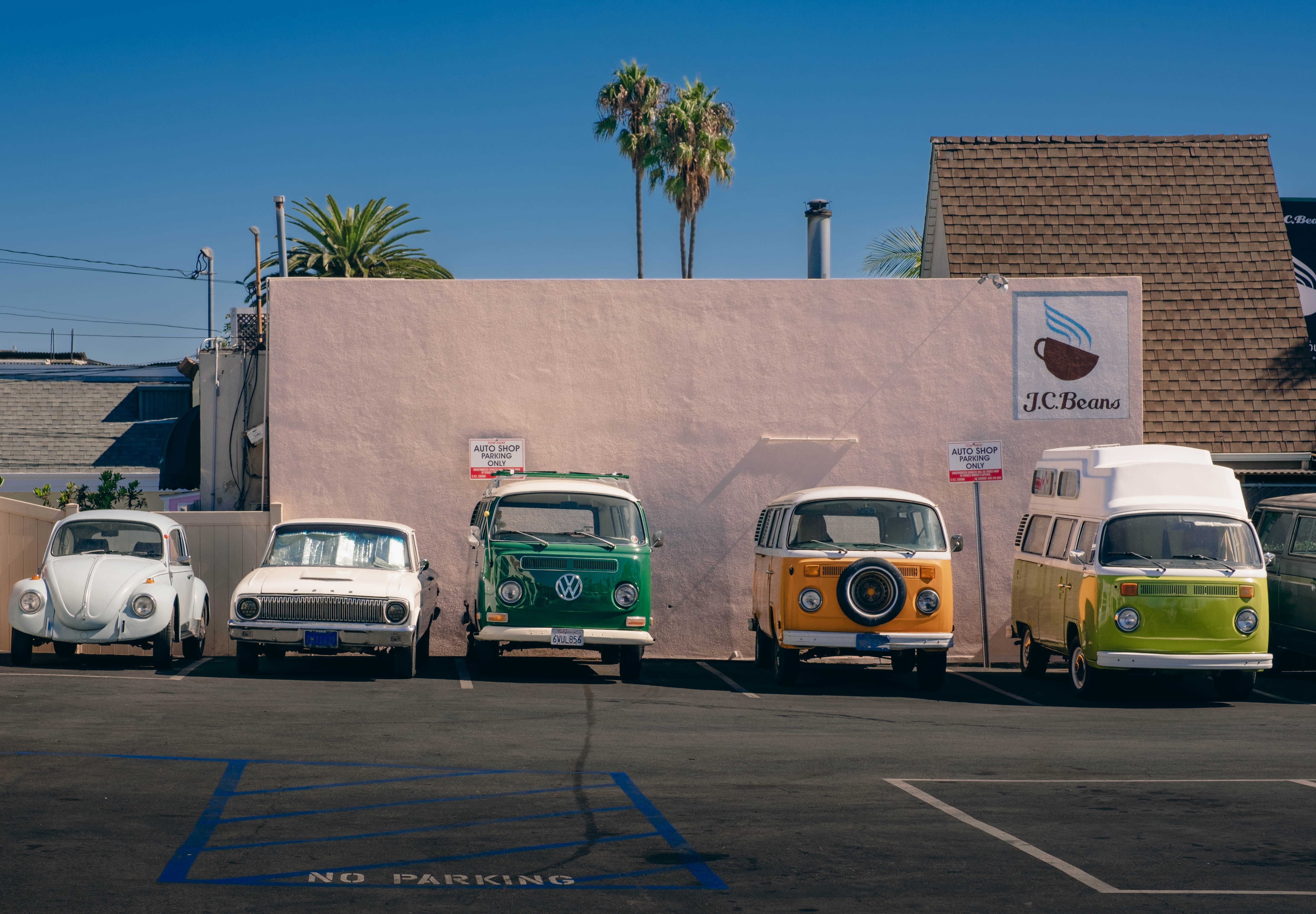 Volkswagen Beetles and Vans in Parking Lot HD Wallpaper