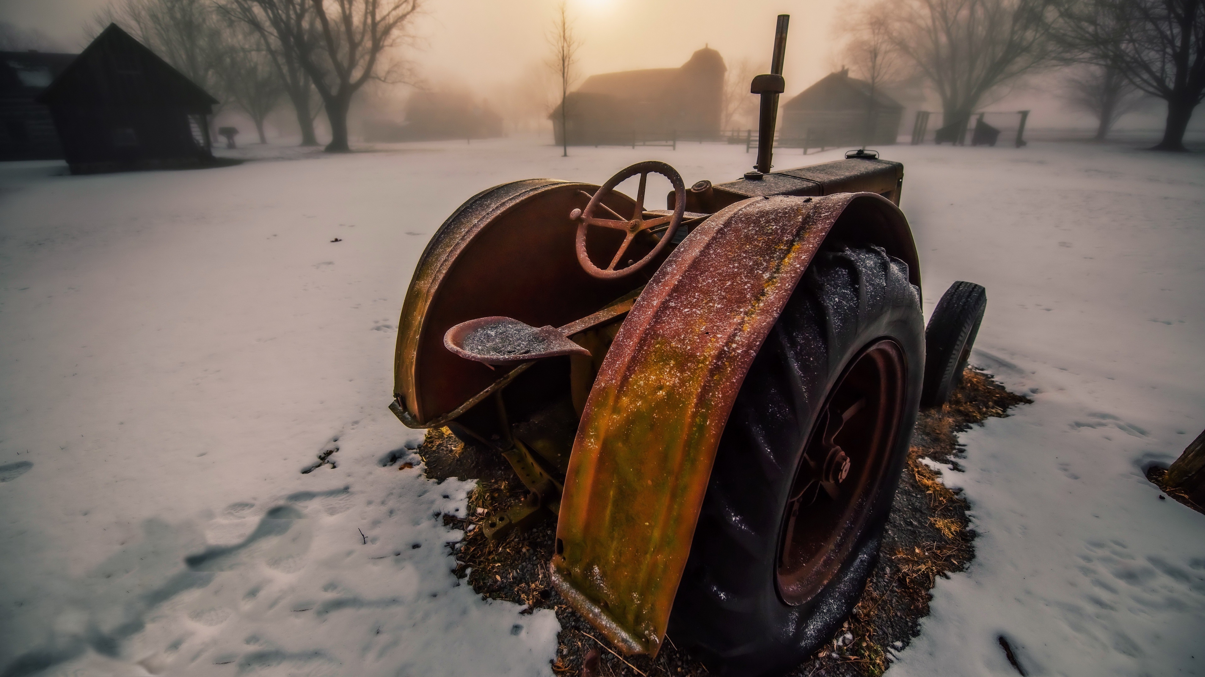 Rusty tractor in the snow on a foggy day HD Wallpaper