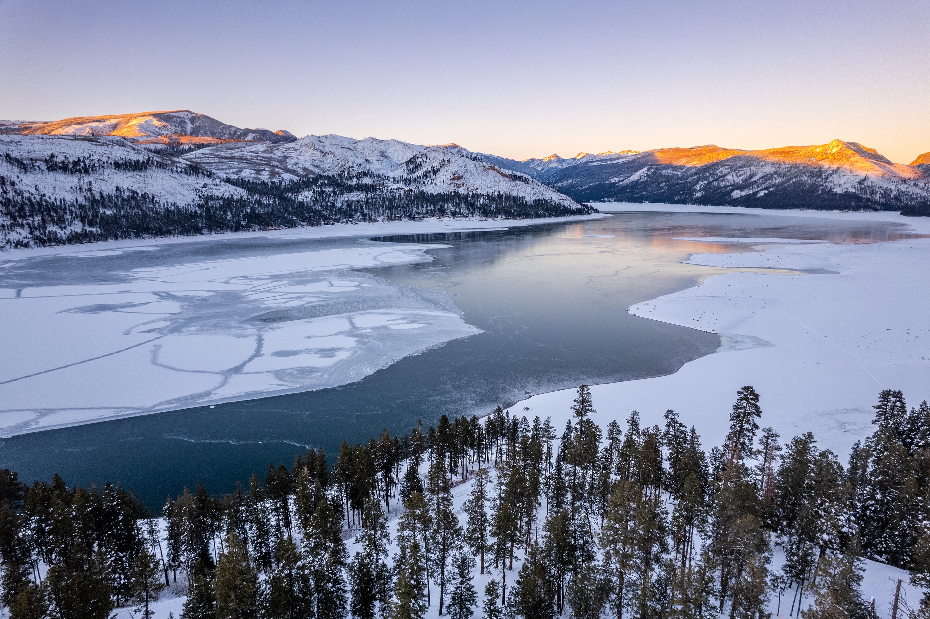 Snowy mountain lake at sunrise HD Wallpaper