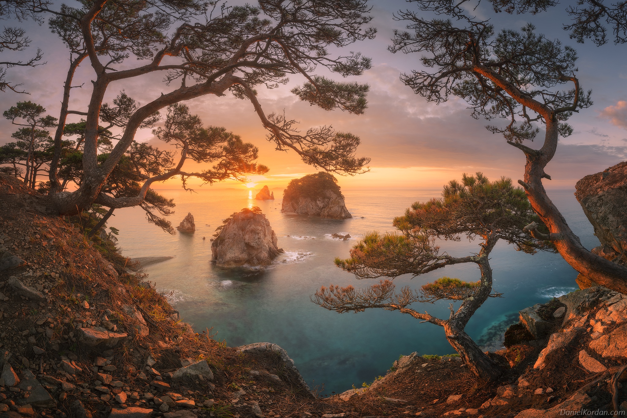Daniel Kordan sunset over rocky islands and pine trees HD Wallpaper