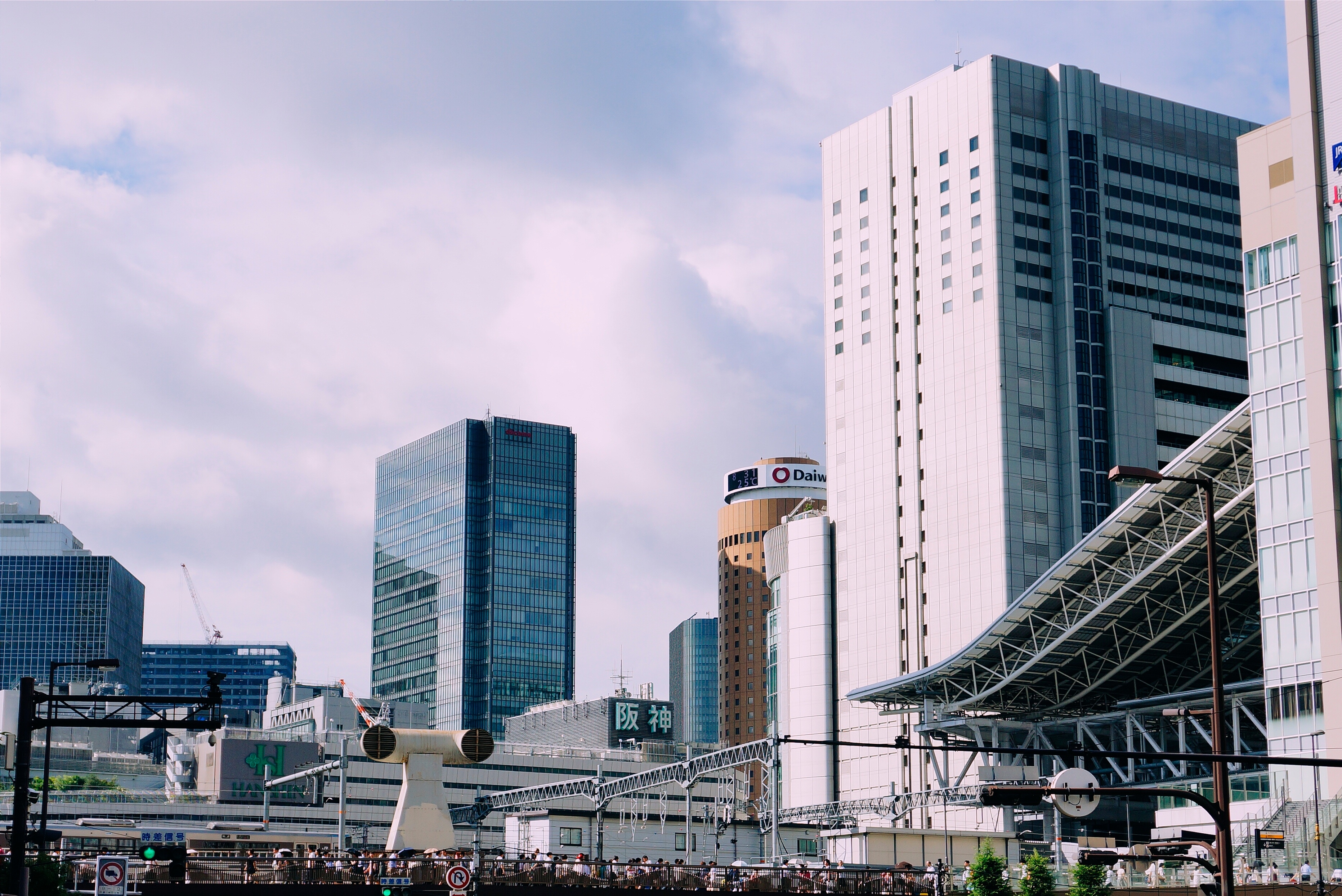 Osaka cityscape with modern buildings and train station HD Wallpaper