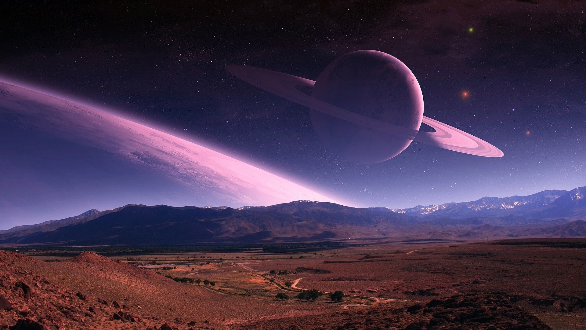 Ringed planet in a purple alien sky over mountains HD Wallpaper