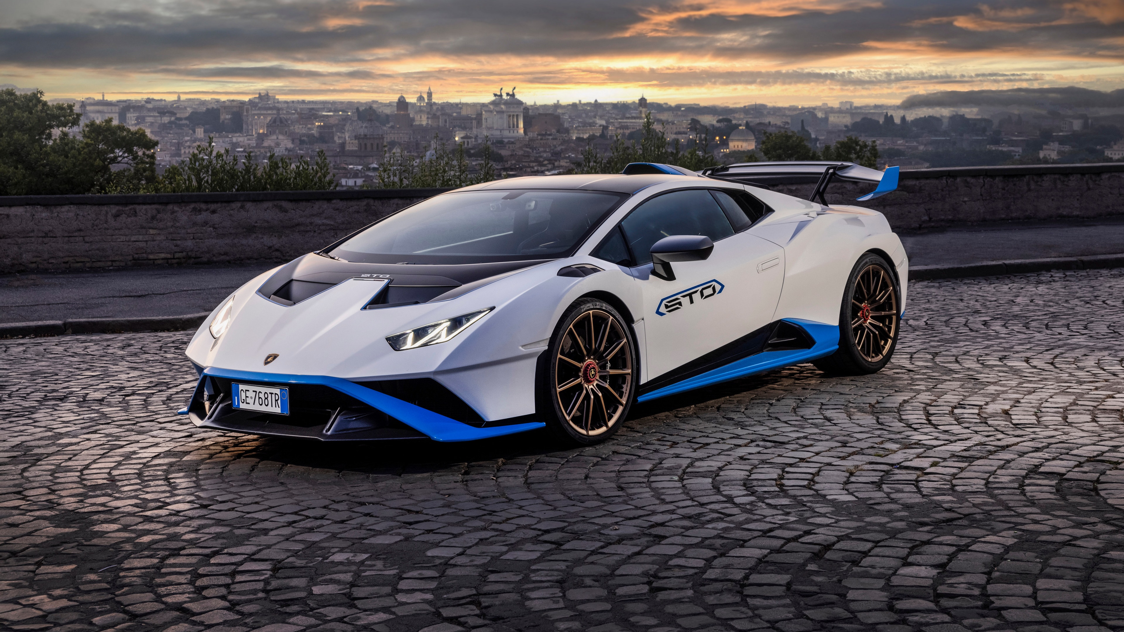 4K Lamborghini Huracan STO on cobblestone road in city HD Wallpaper