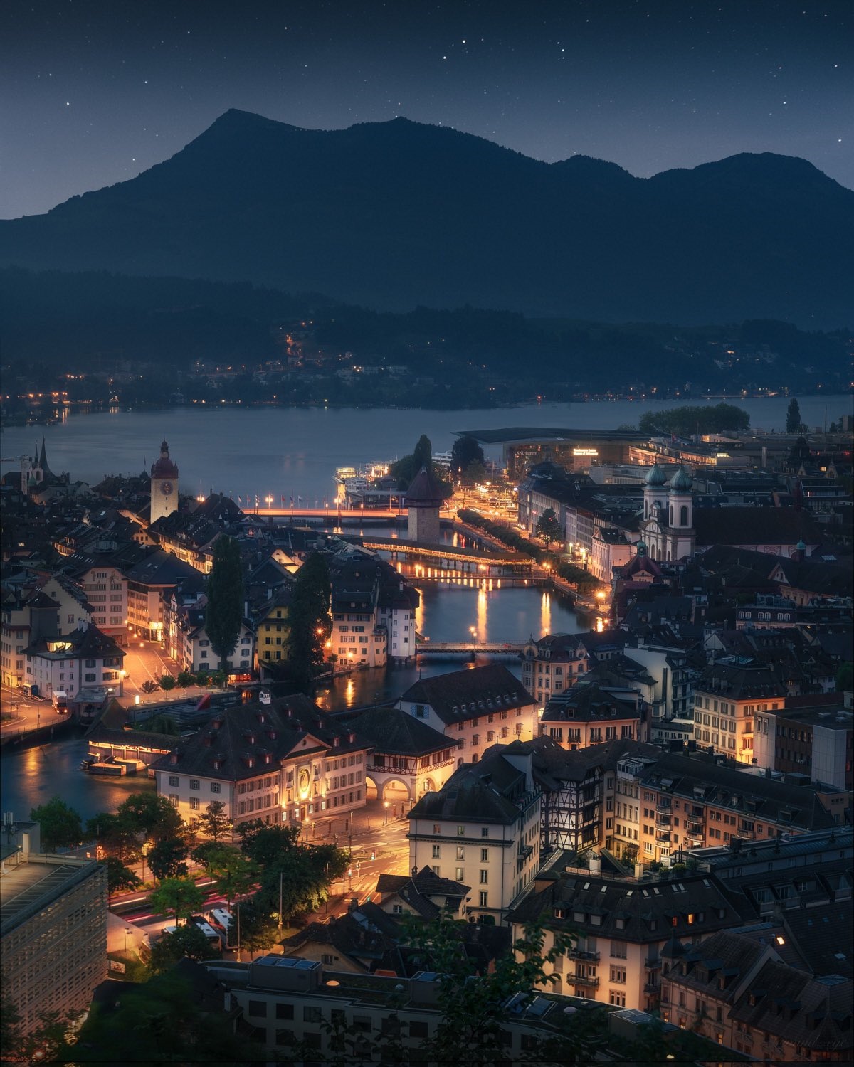 Luzern cityscape at night with mountains and lake HD Phone Wallpaper