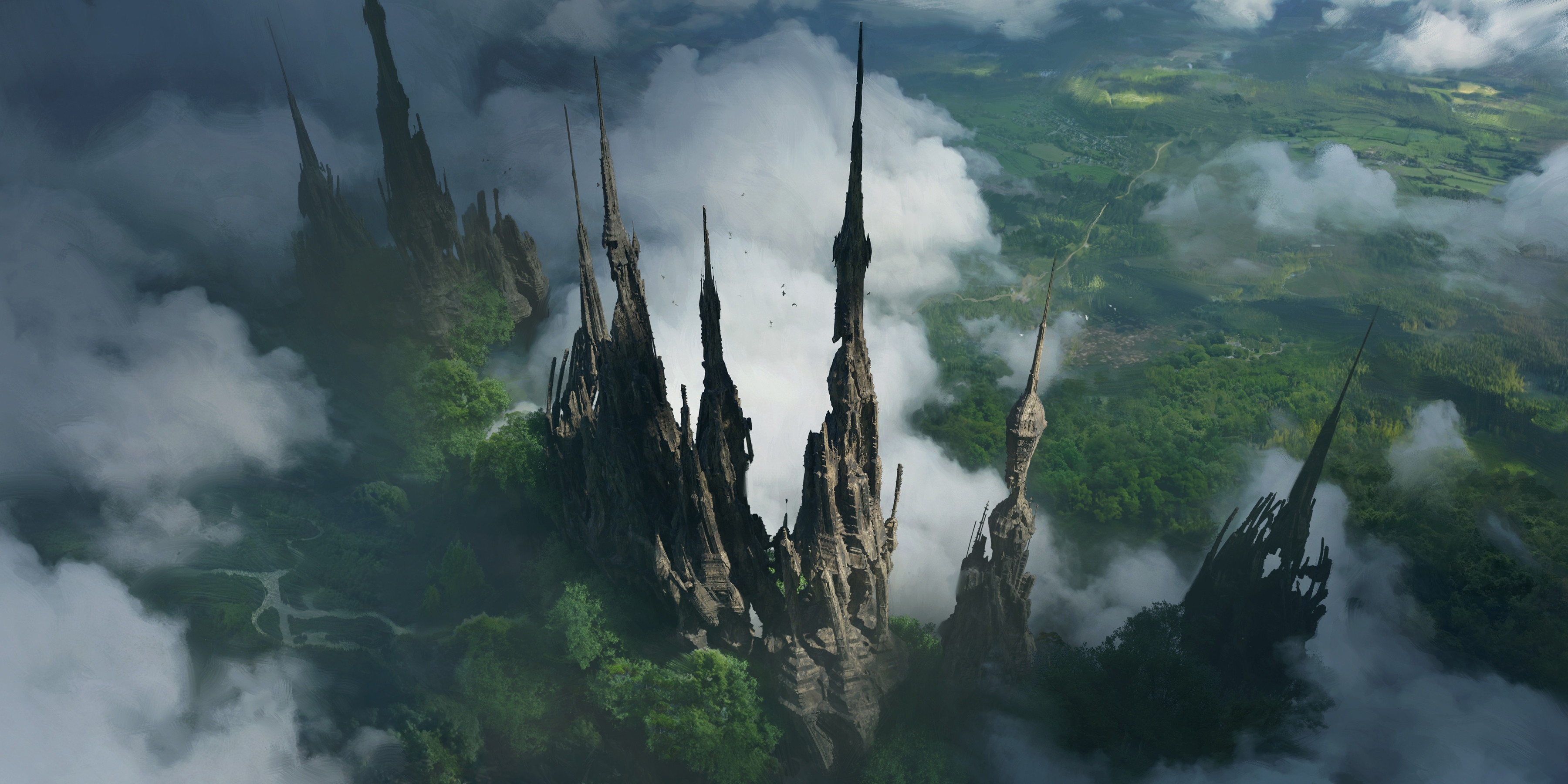 Jagged rock formations rise from a misty, green landscape. HD Wallpaper