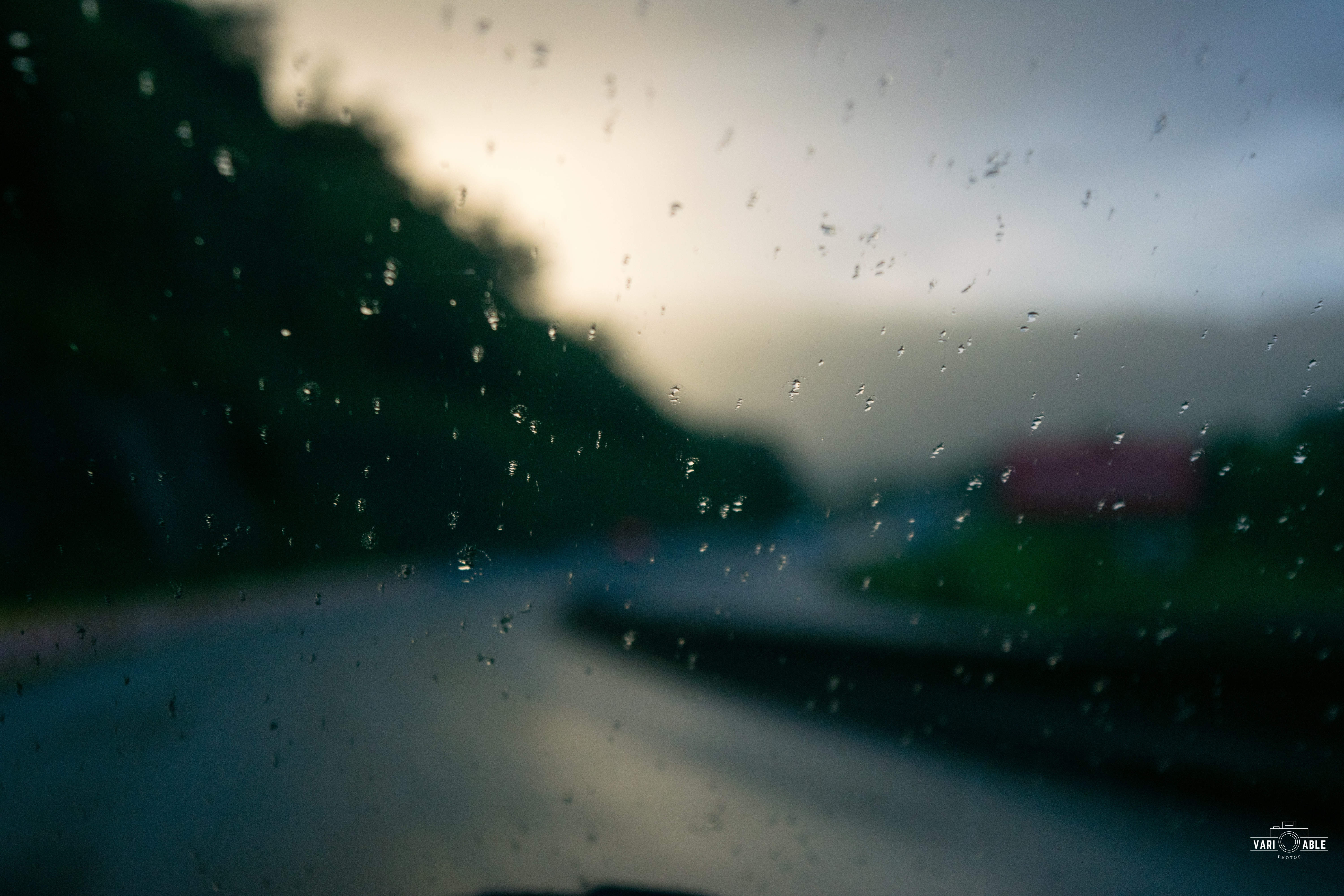 Driving on a rainy highway at dusk HD Wallpaper