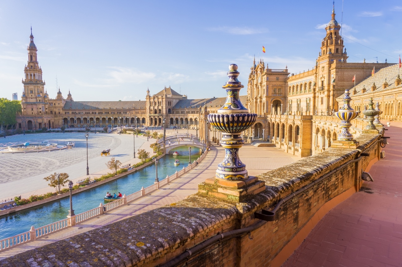 Plaza de España in Seville with canal and ornate buildings HD Wallpaper