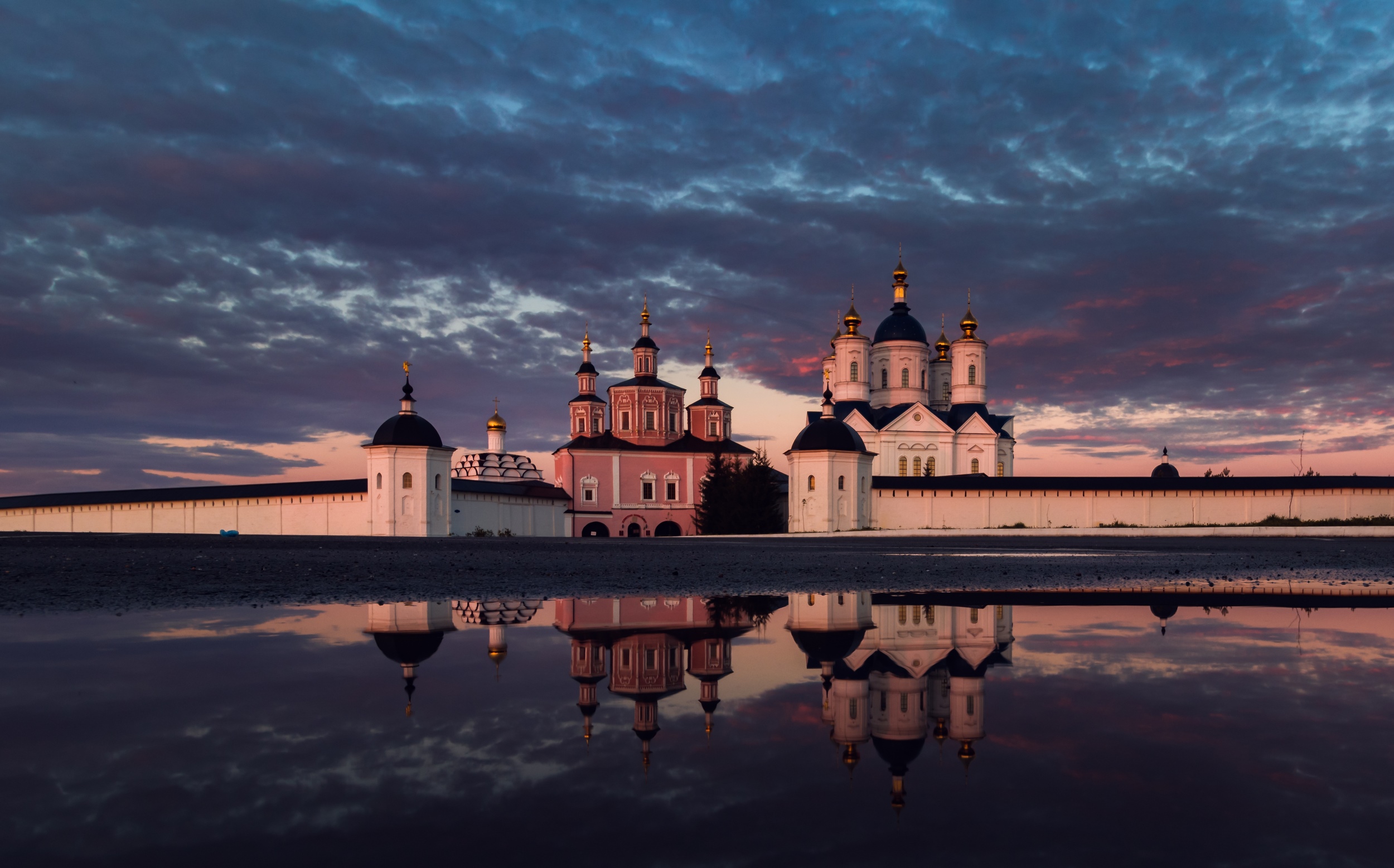 Monastery with domes reflected in water at sunset HD Wallpaper