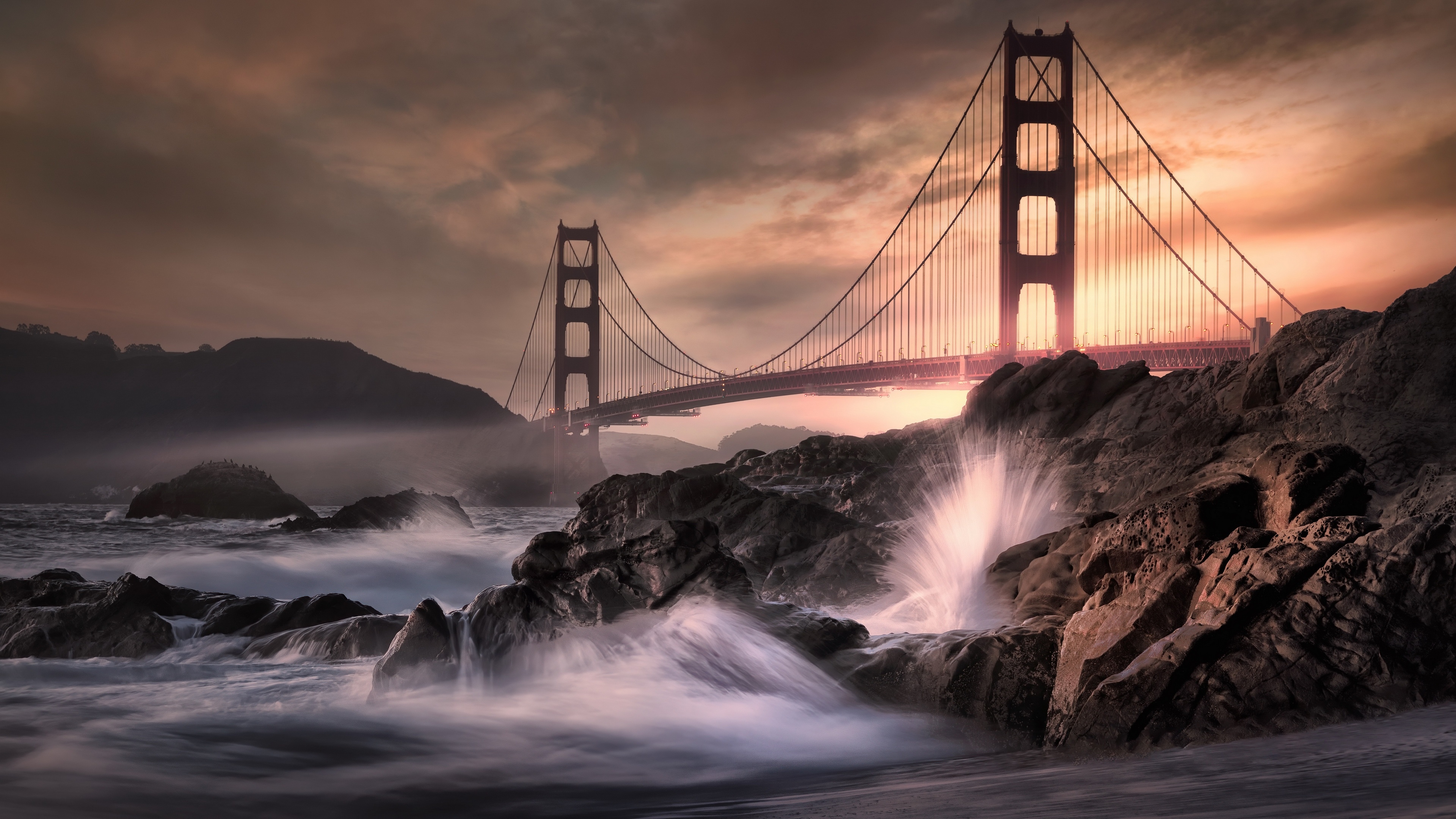 Golden Gate Bridge with waves crashing on rocks HD Wallpaper