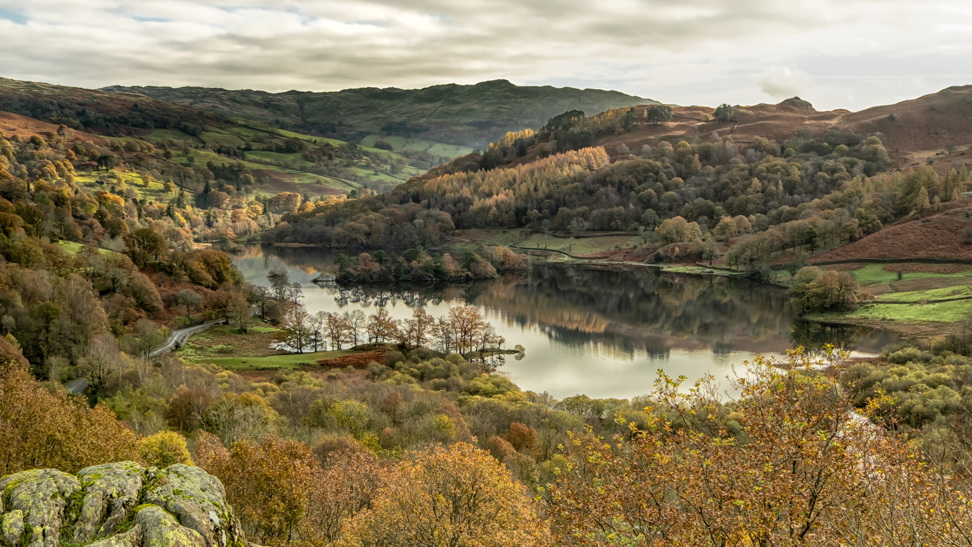 4K landscape of a lake surrounded by autumn forest HD Wallpaper