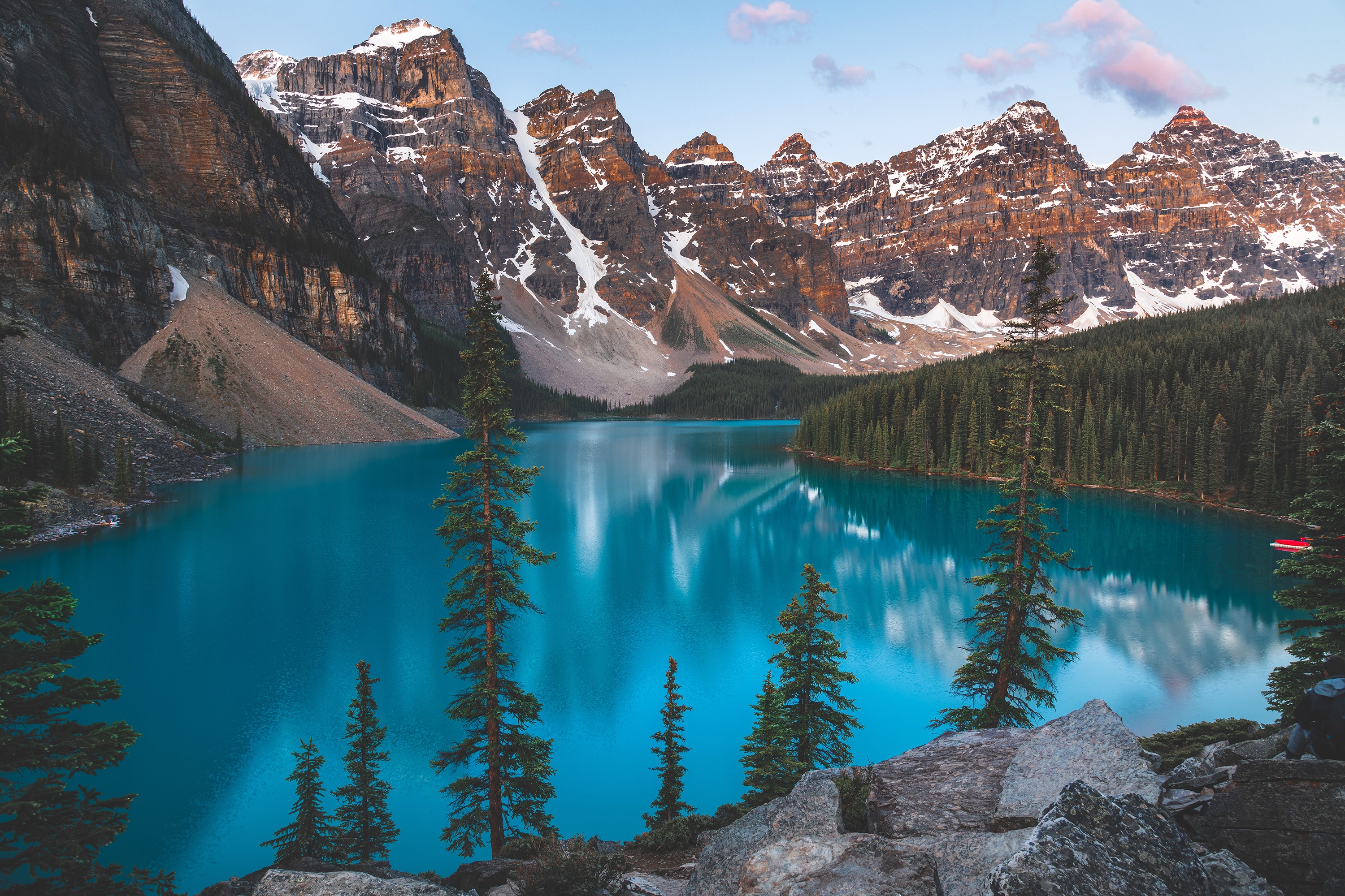 Moraine Lake with snow-capped mountains and pine forest HD Wallpaper