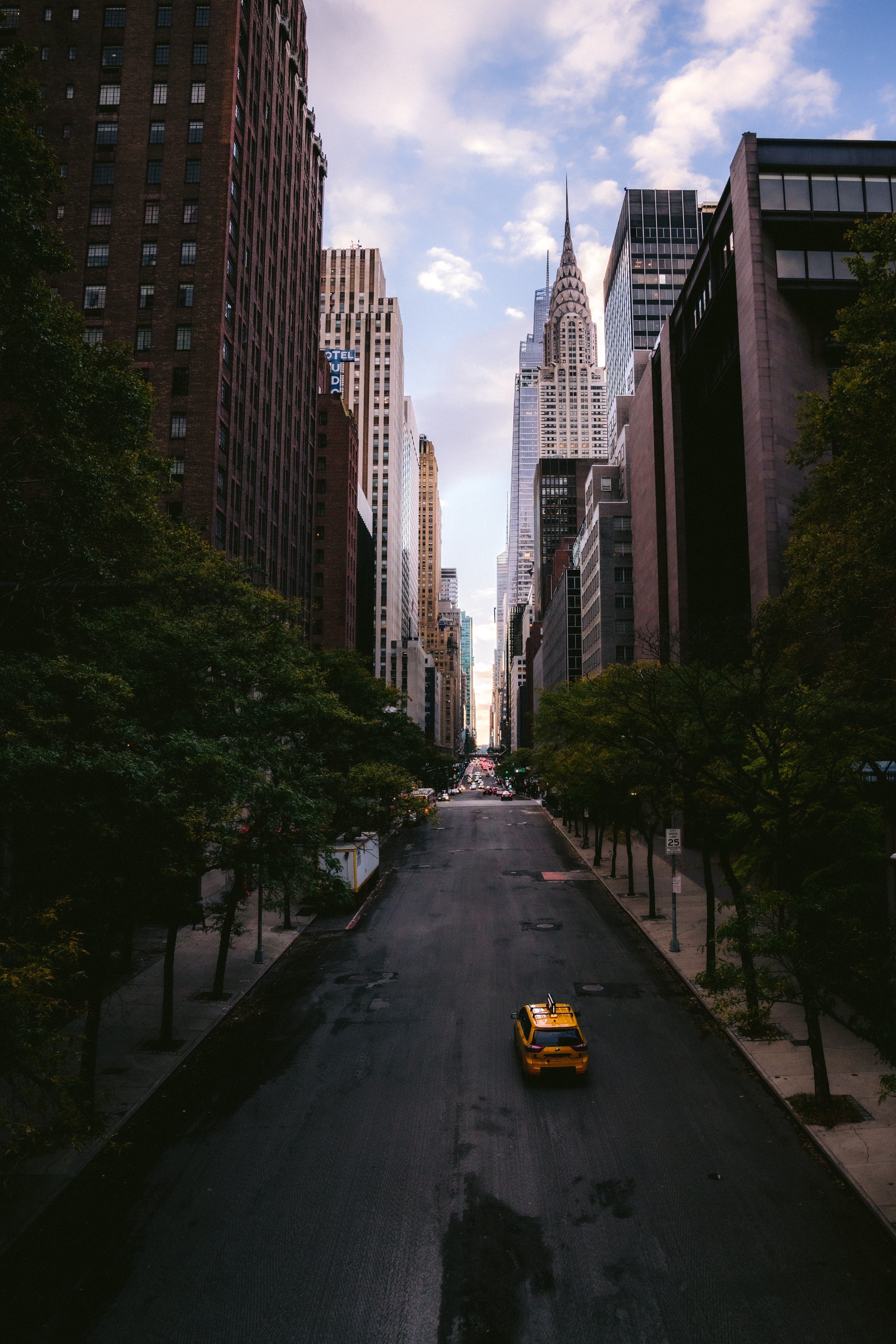 Chrysler Building and yellow taxi on a New York City street HD Phone Wallpaper
