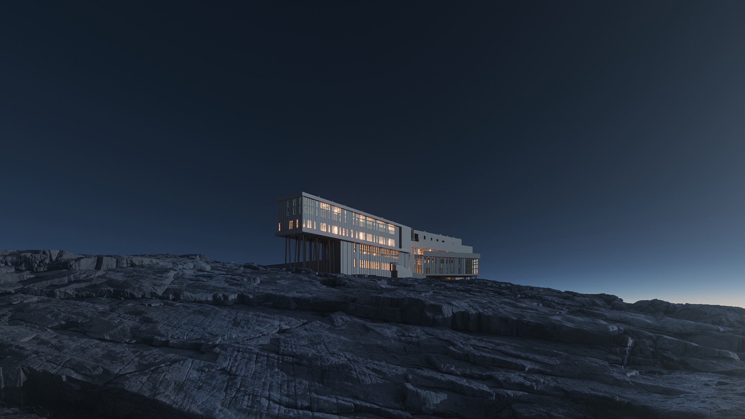 Modern building on rocky terrain at night HD Wallpaper