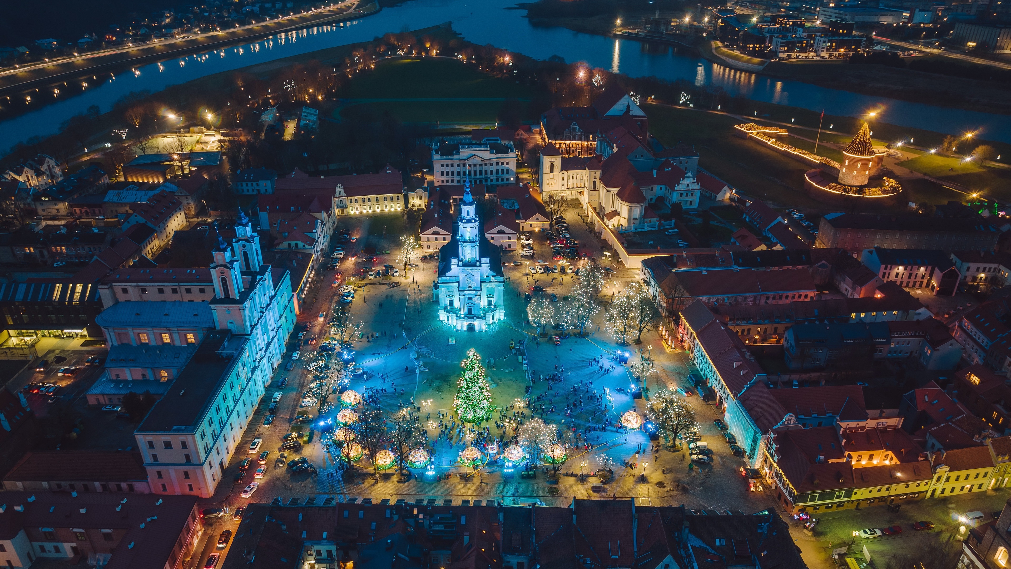 4K aerial view of Kaunas Christmas market and city lights HD Wallpaper