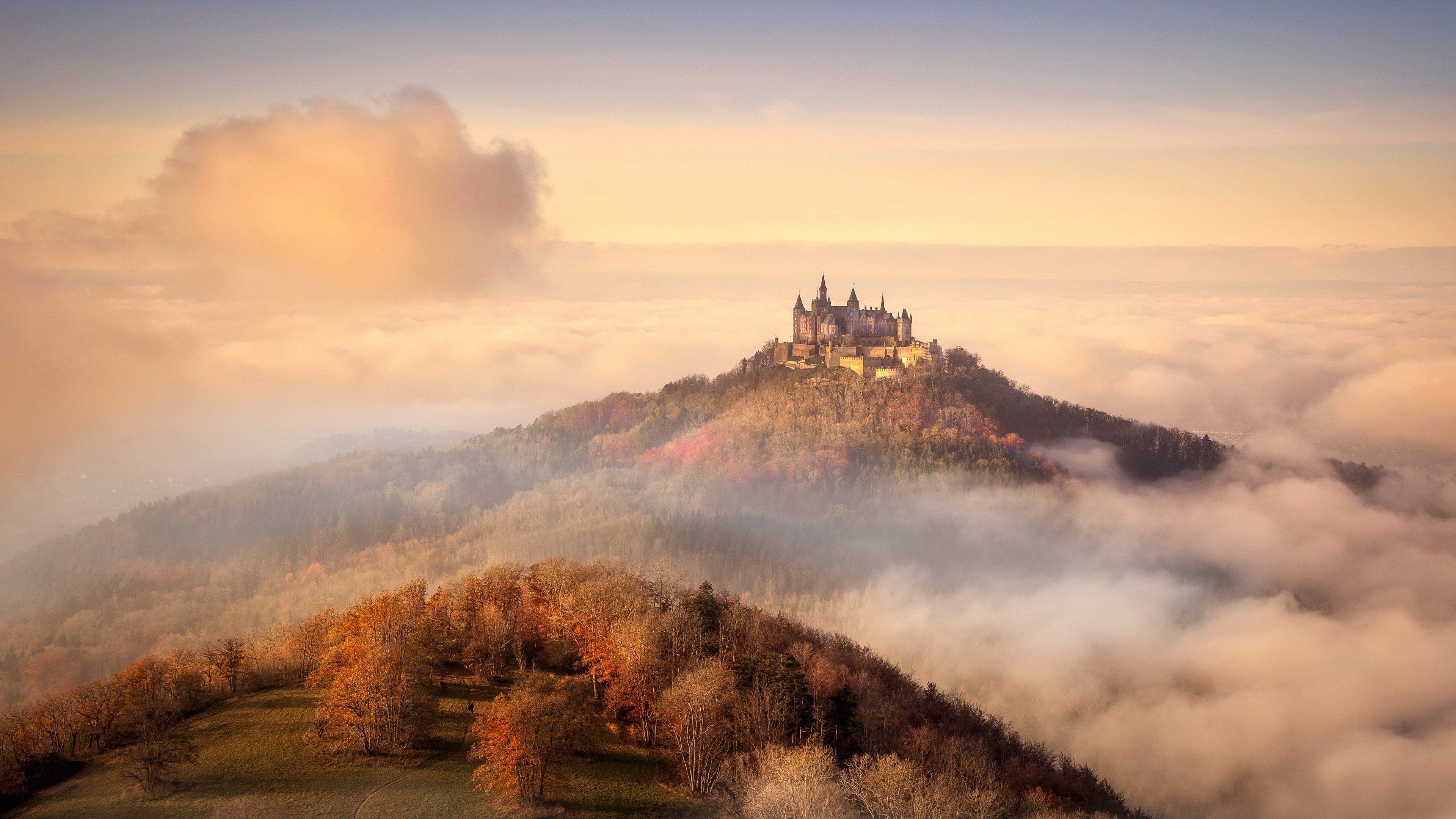 4K Burg Hohenzollern castle in fall with orange sky HD Wallpaper