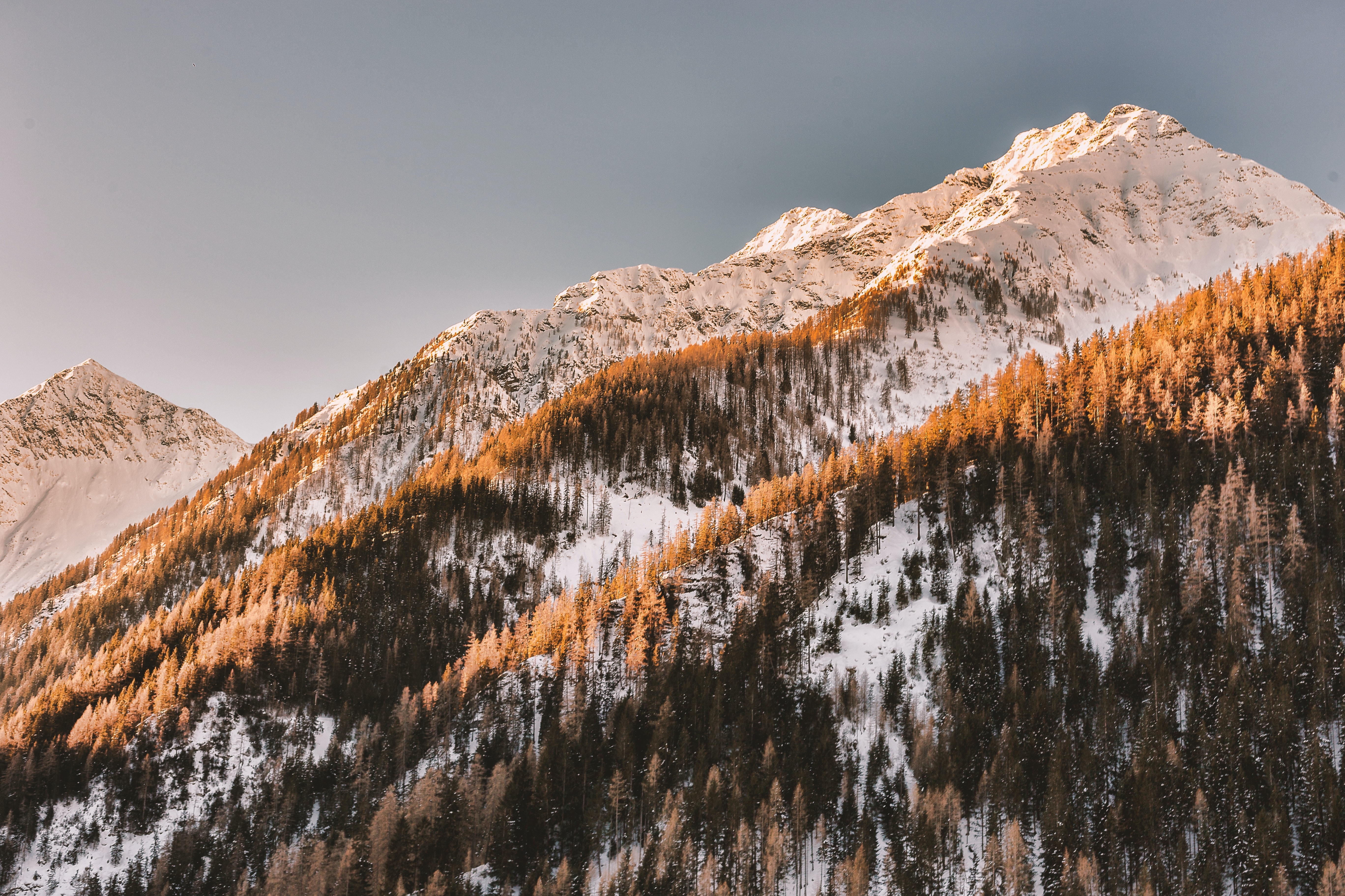 Snowy mountains in the Alps during golden hour HD Wallpaper