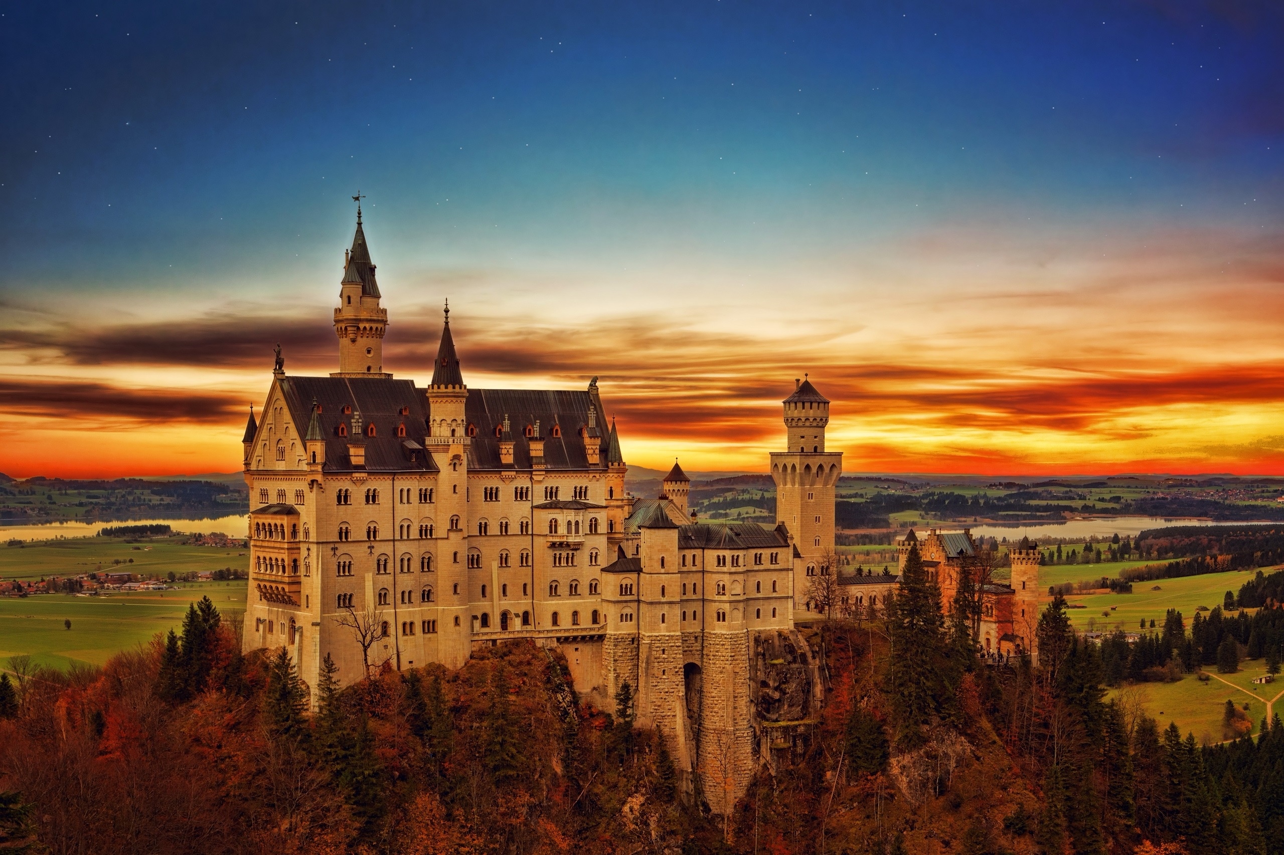 Neuschwanstein Castle at sunset with a colorful sky HD Wallpaper