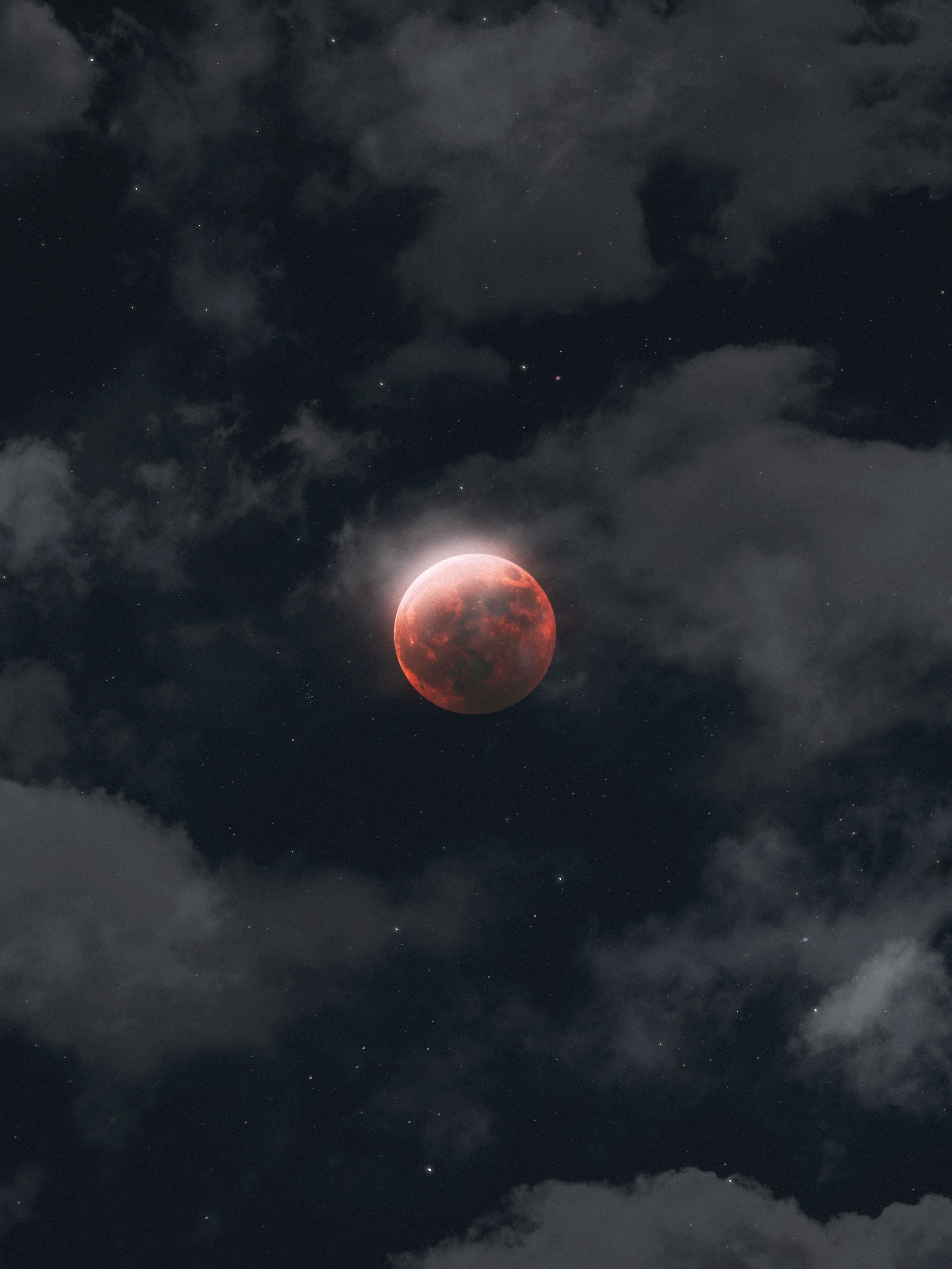 Red moon in a cloudy night sky with stars HD Phone Wallpaper