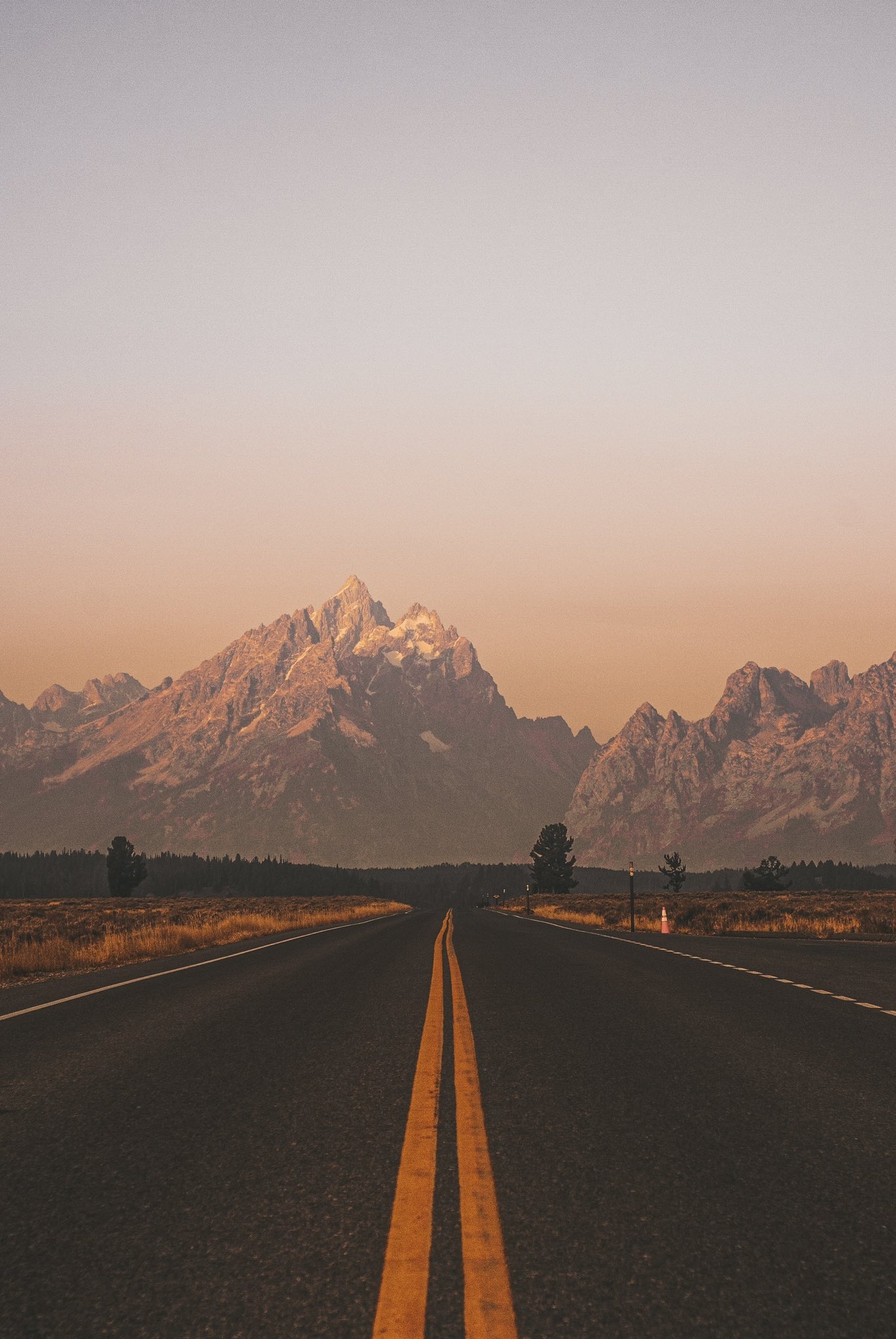 Road leading to mountains at sunset HD Phone Wallpaper