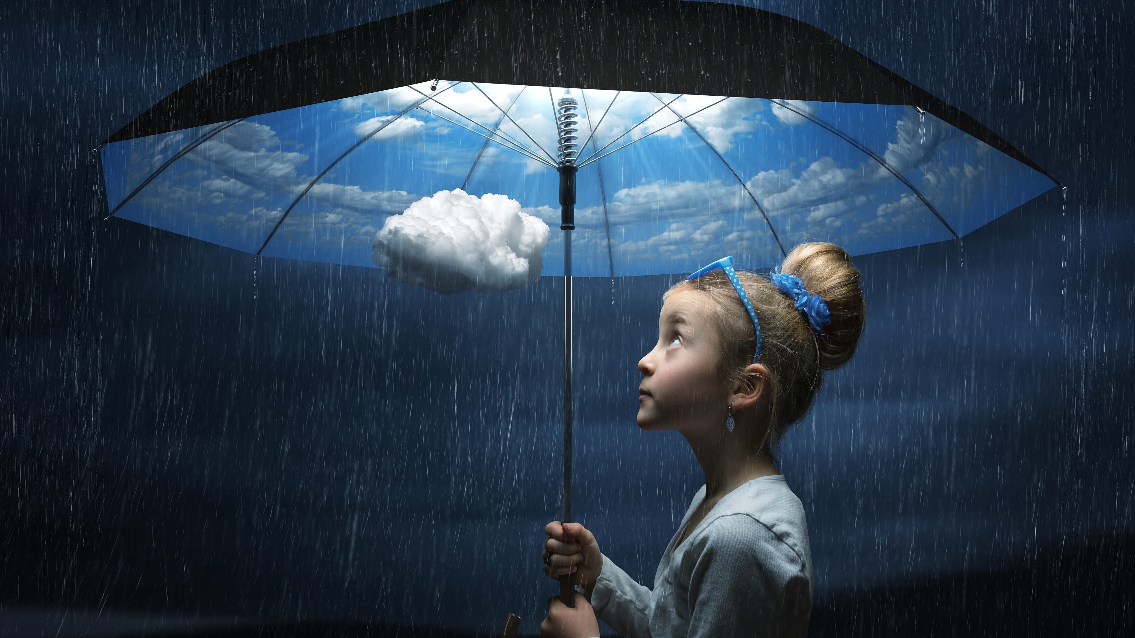 Surreal art installation of a girl under an umbrella HD Wallpaper