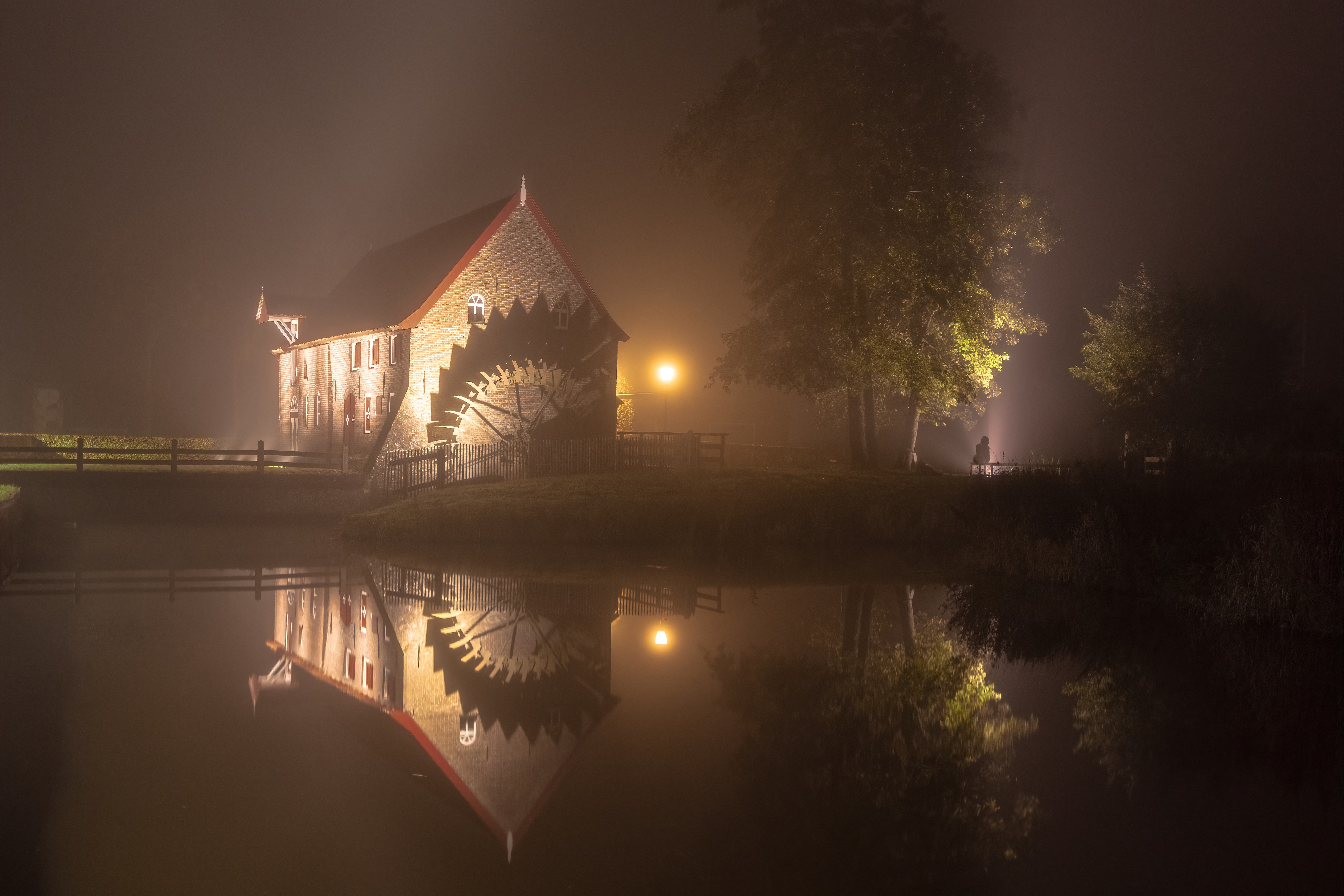 Watermill at night with mist and reflection HD Wallpaper