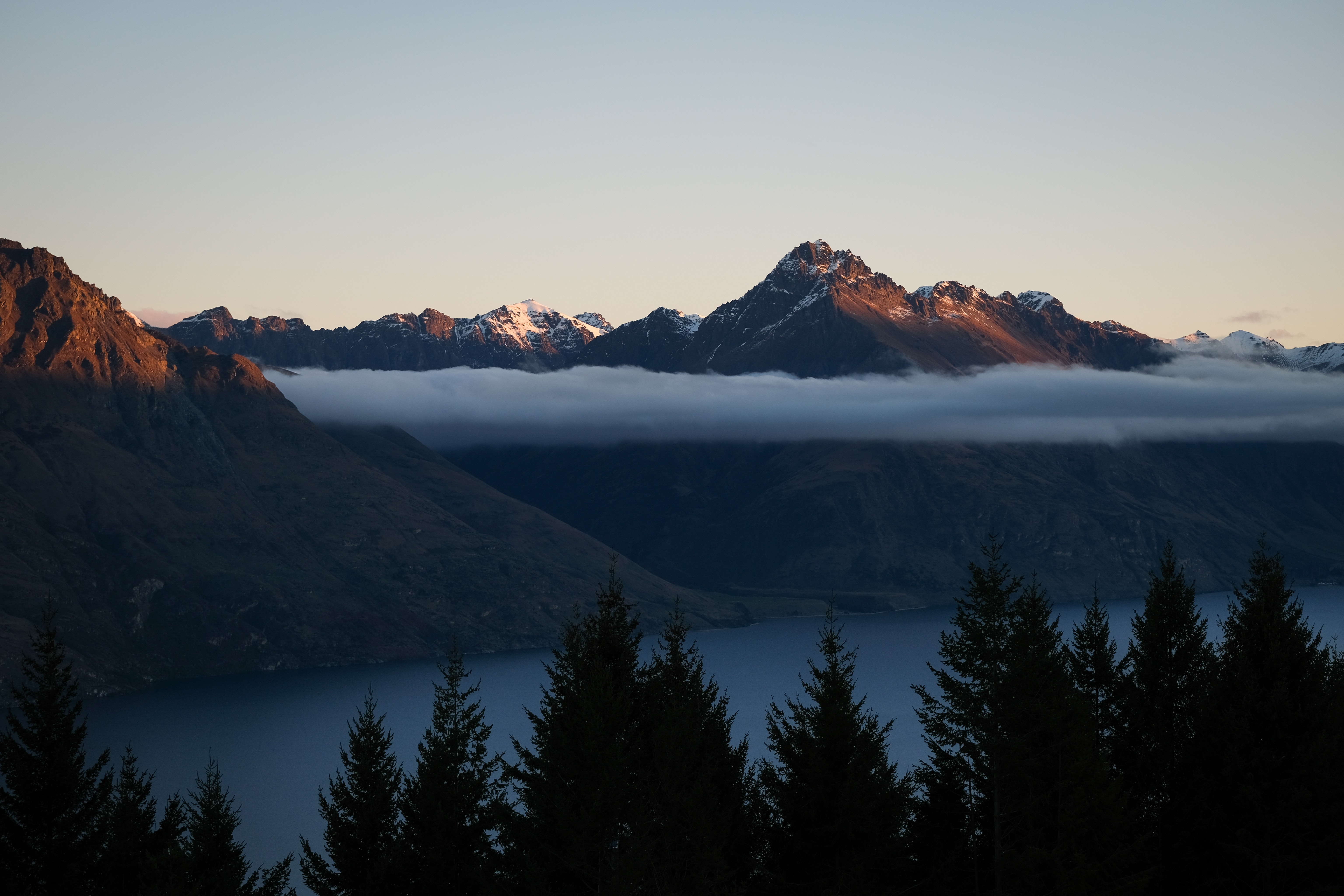 Mountains over a lake with clouds and trees HD Wallpaper