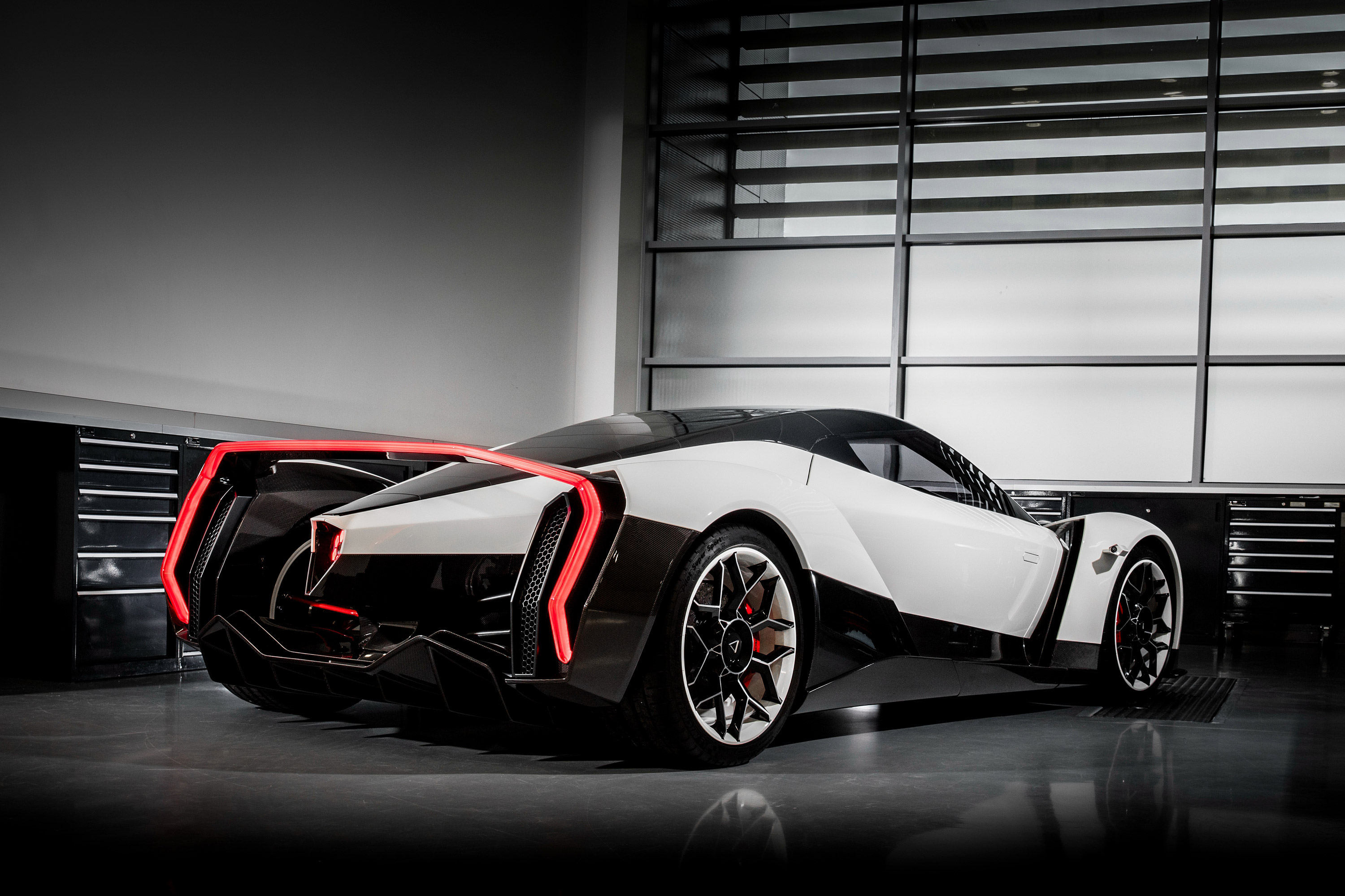 Vanda Dendrobium electric sports car in a garage HD Wallpaper