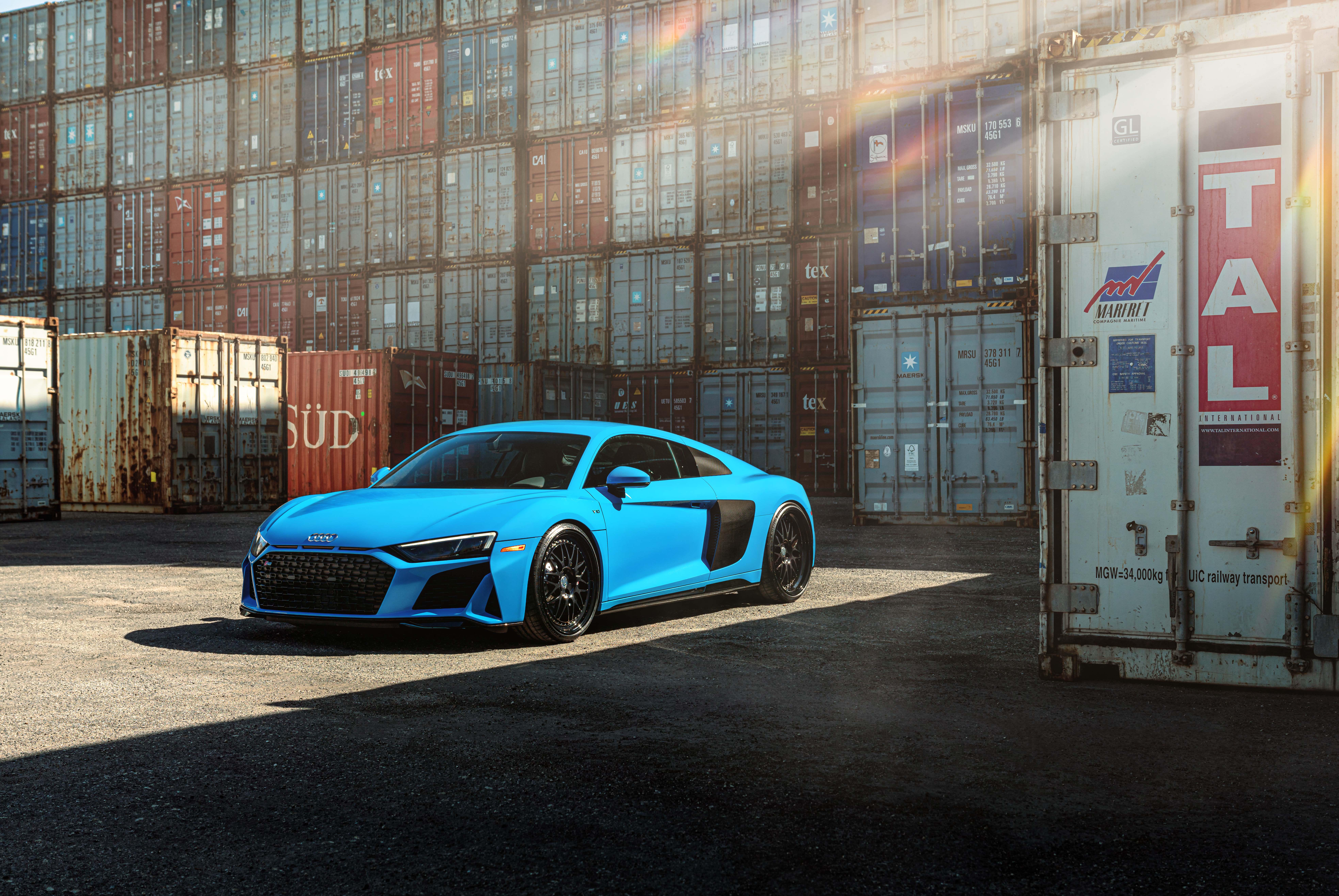 Blue Audi R8 parked near shipping containers HD Wallpaper