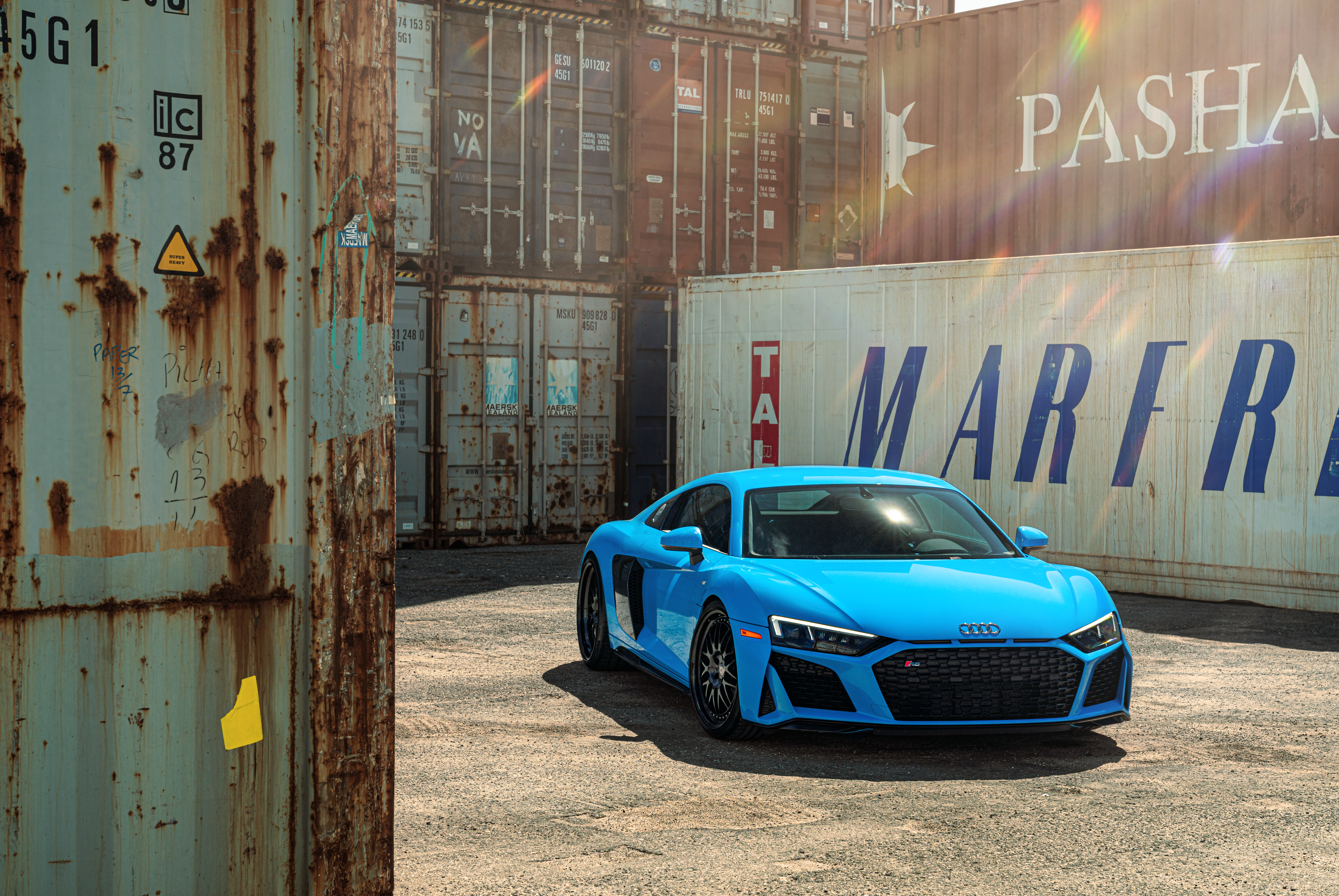 Blue Audi R8 parked near shipping containers HD Wallpaper
