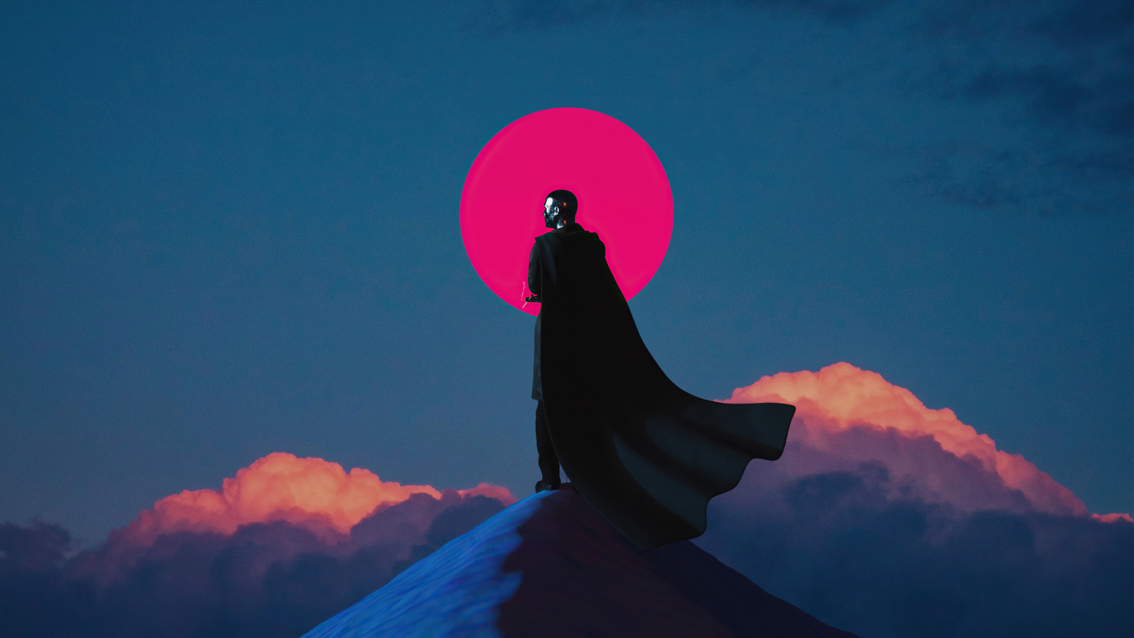 Man in cape standing on a peak under a red moon HD Wallpaper