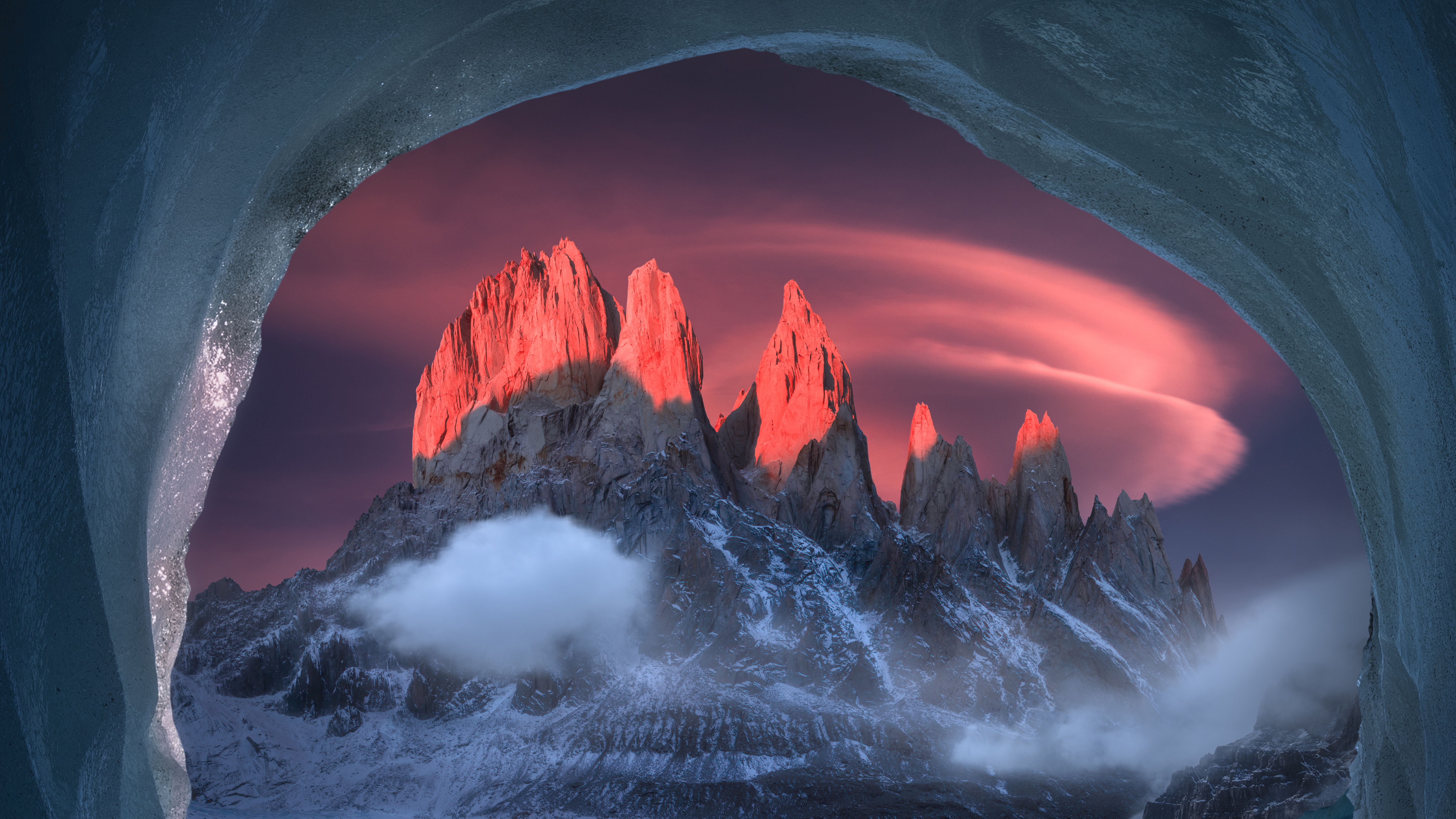 Fitz Roy mountains at sunset viewed from a cave HD Wallpaper