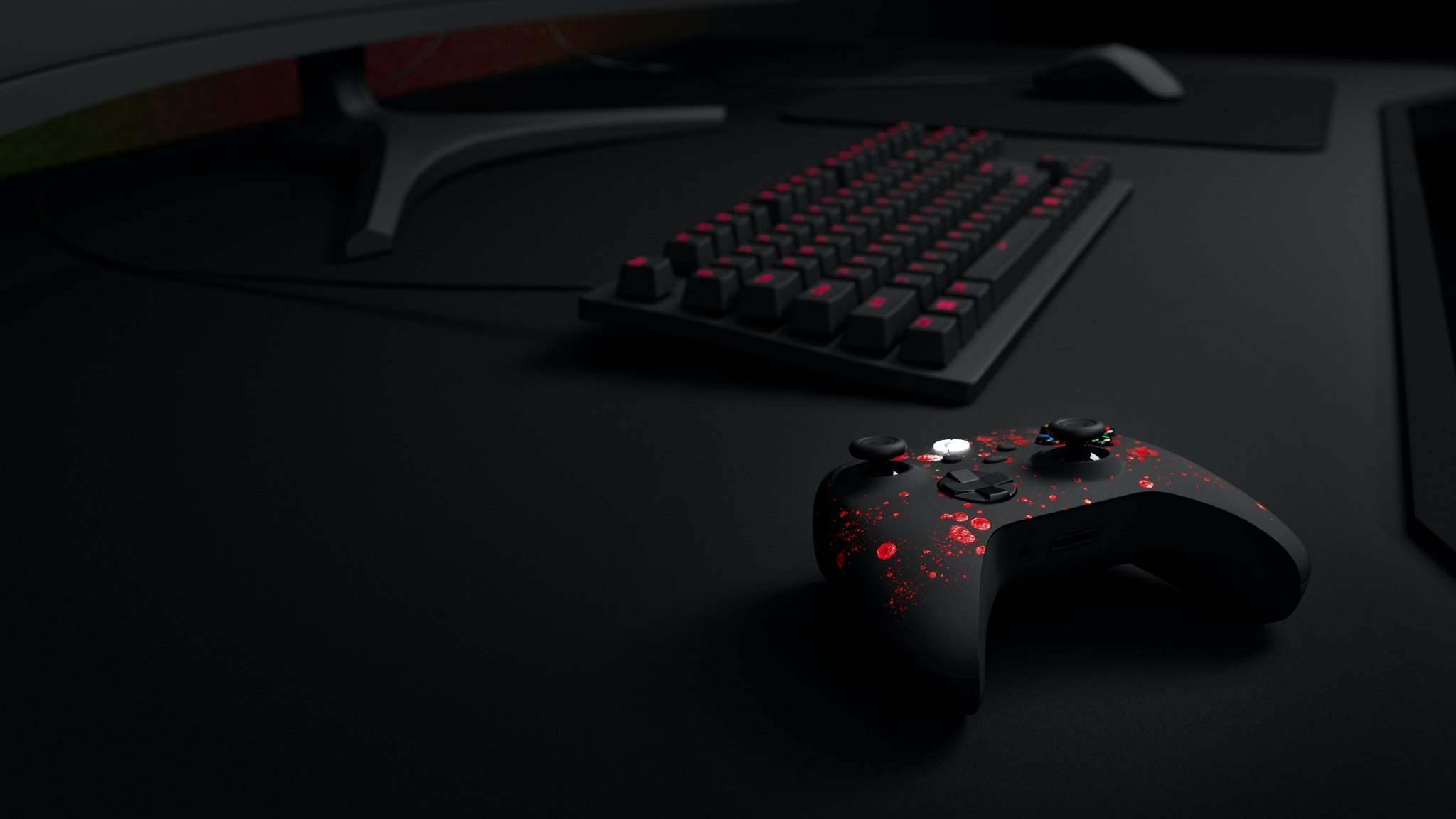 Black Xbox controller with red splatters and gaming setup HD Wallpaper