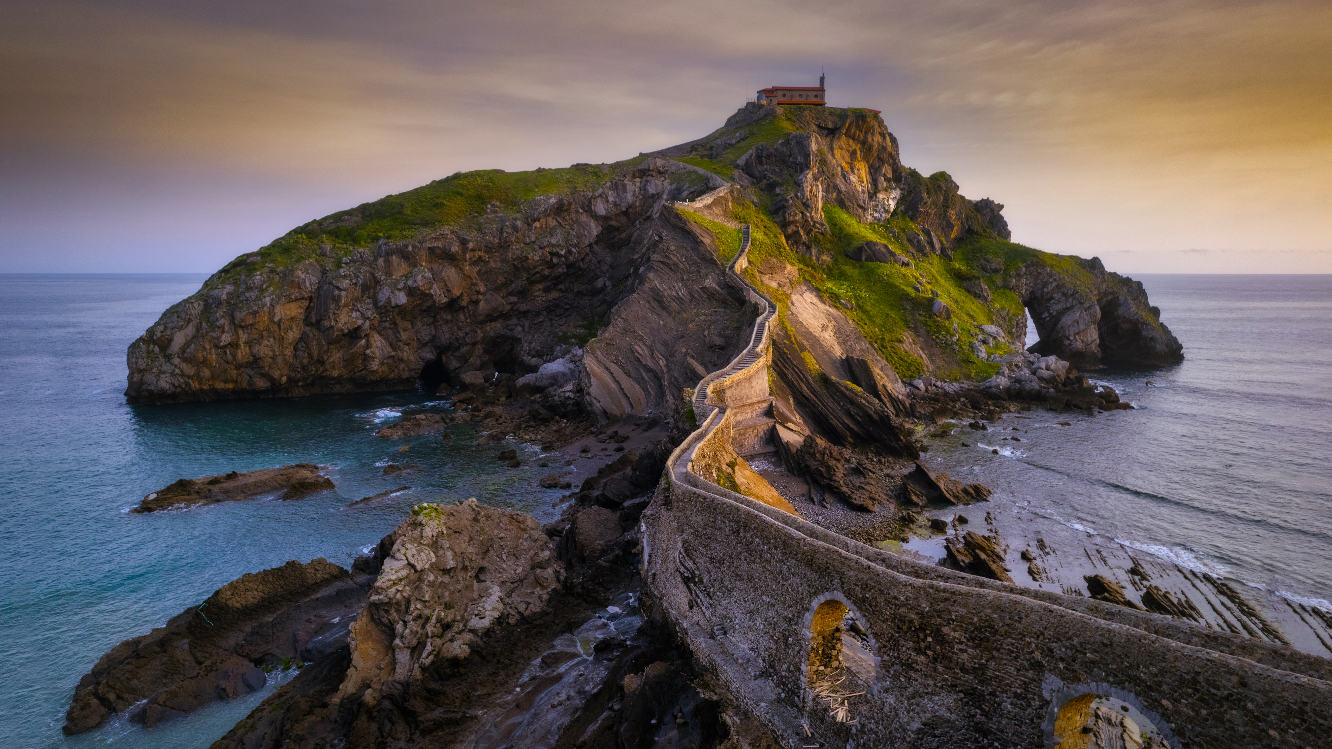 San Juan de Gaztelugatxe island with stone bridge HD Wallpaper
