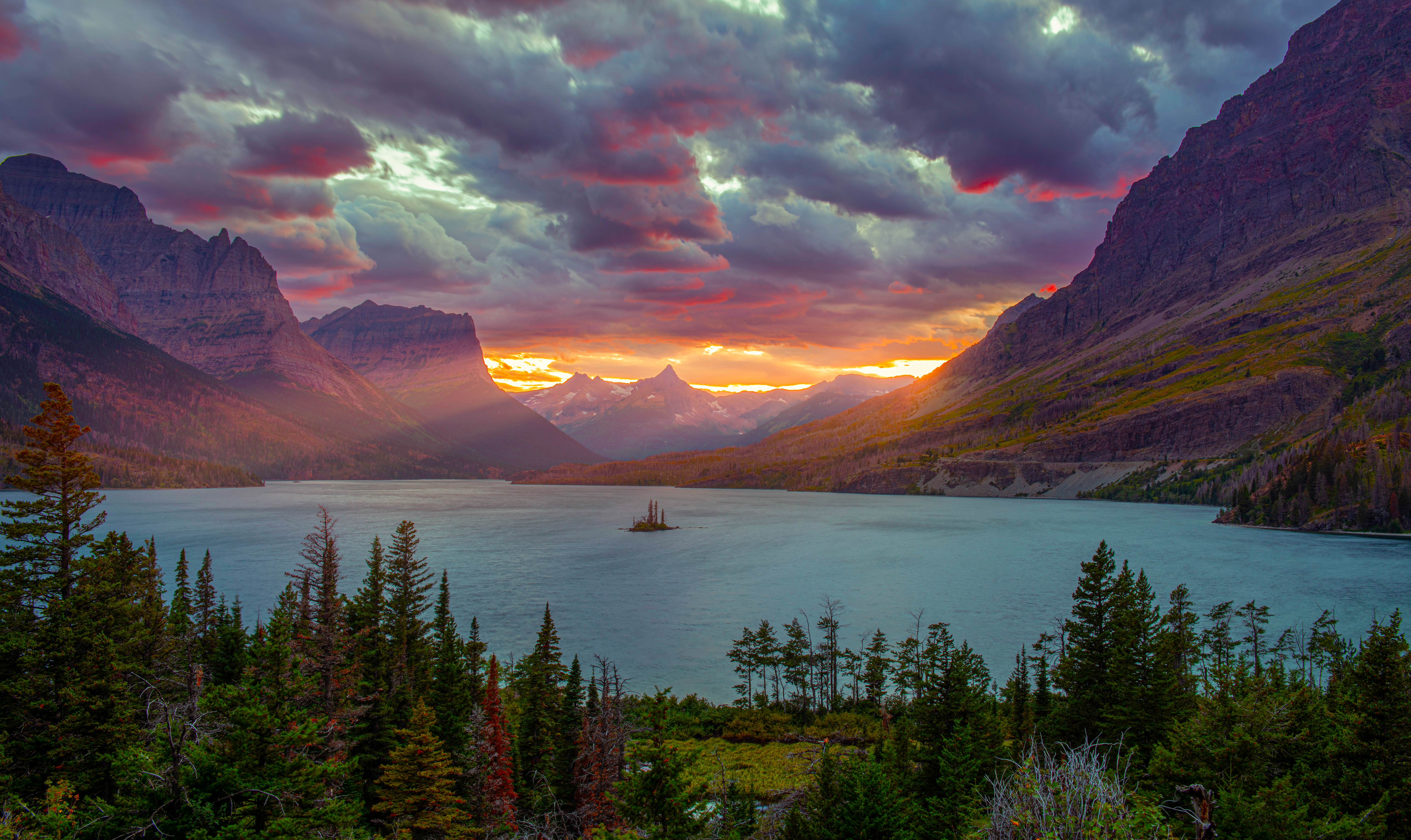 Sunset over a mountain lake with sun rays HD Wallpaper