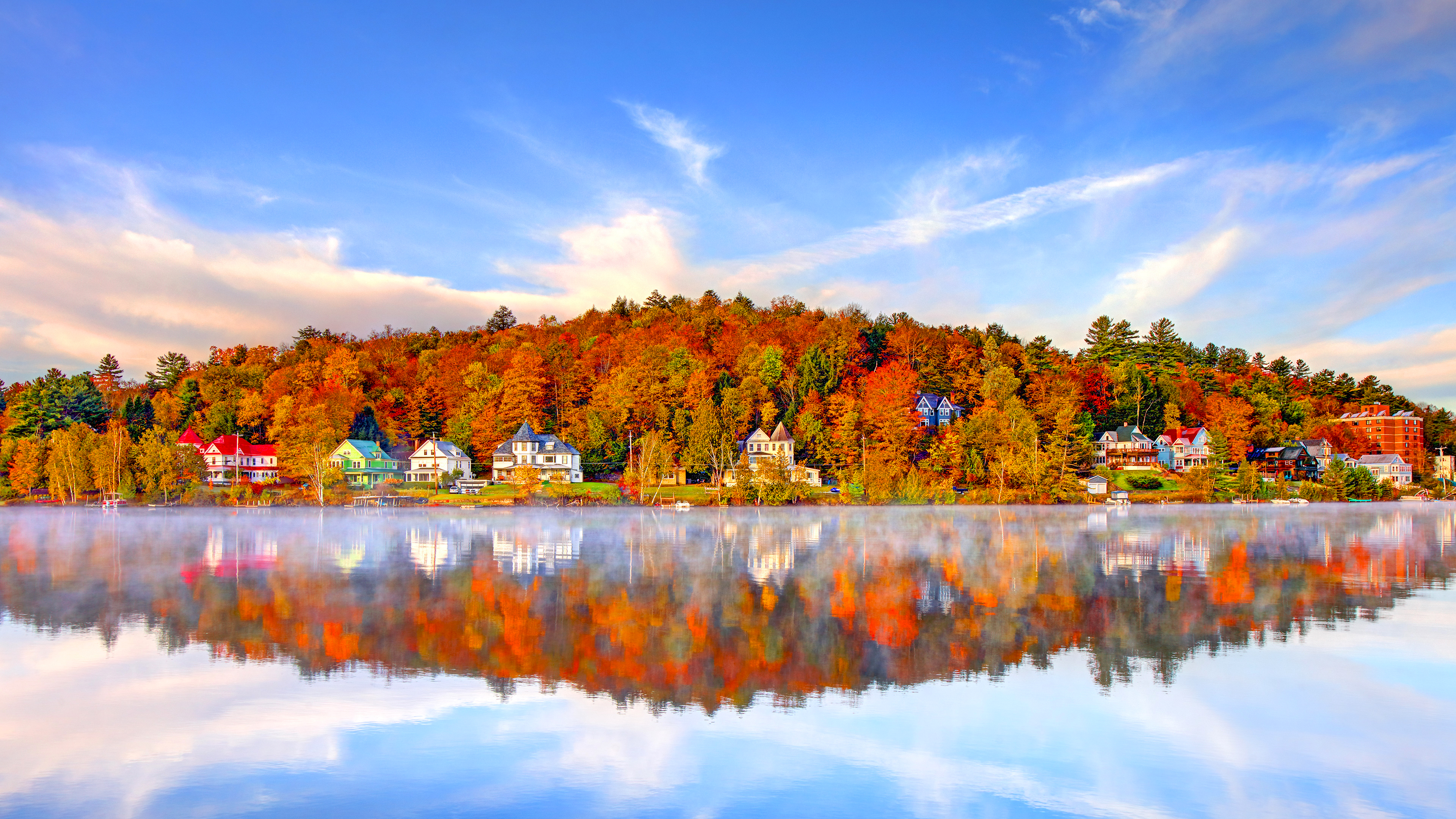 Autumn houses reflected in a misty lake HD Wallpaper