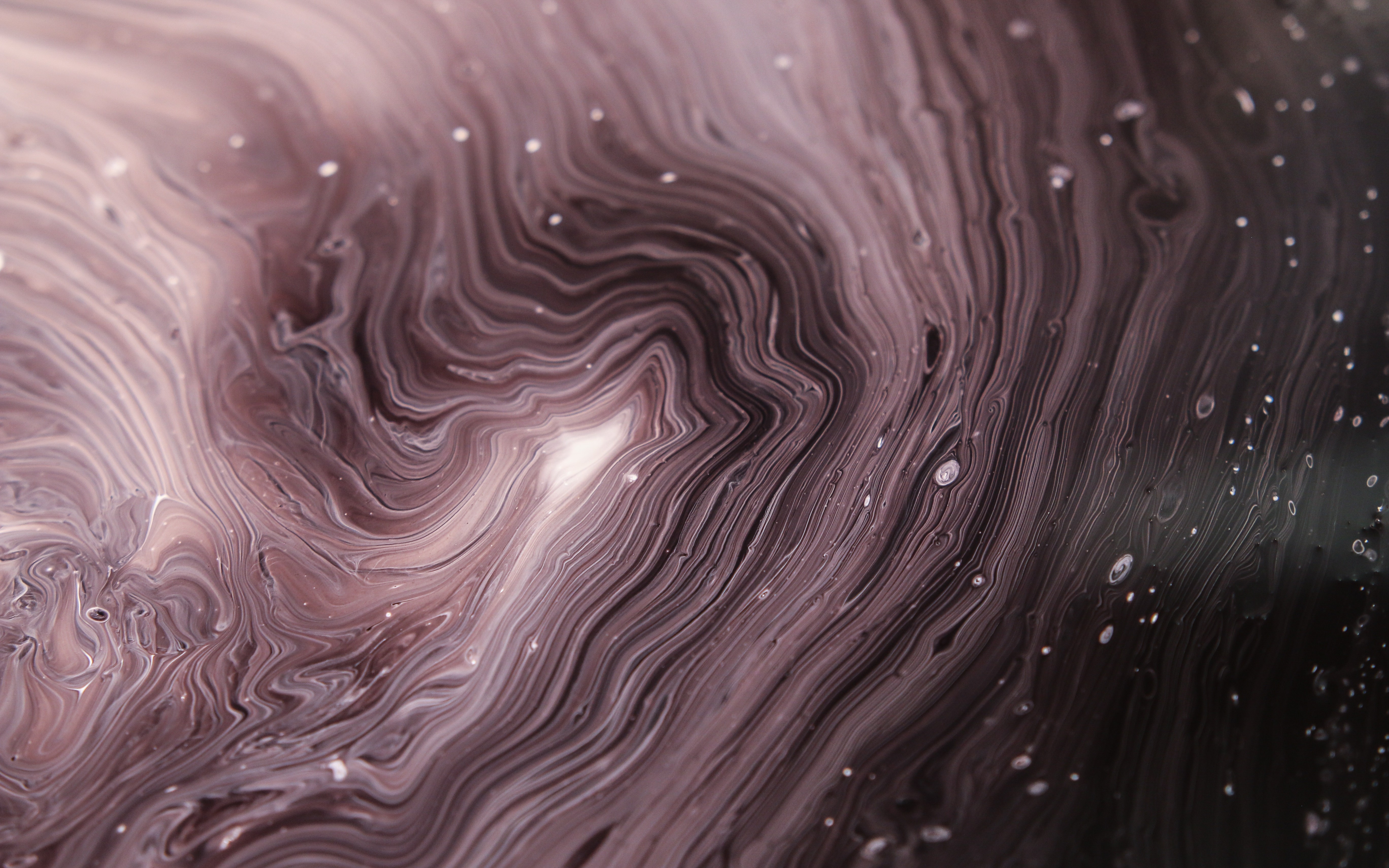 Macro view of swirling brown liquid with small bubbles HD Wallpaper