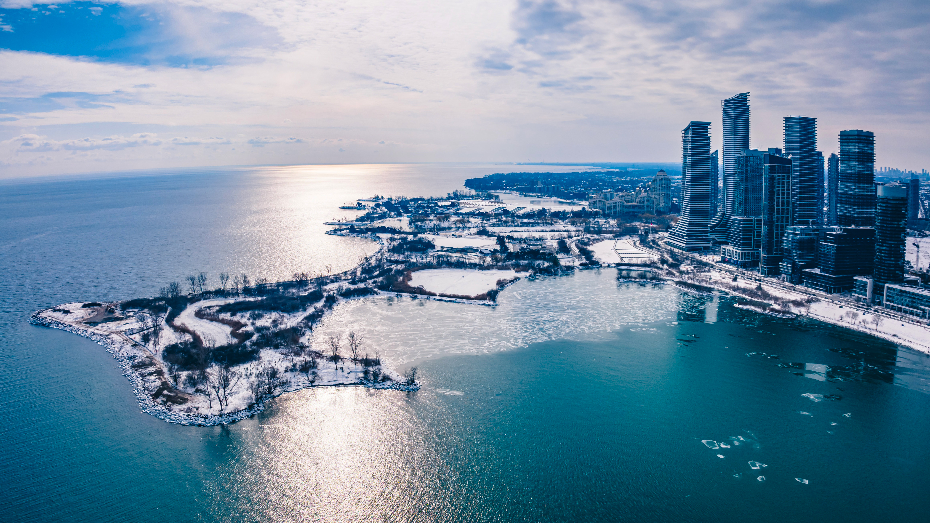 Winter cityscape with frozen lake and skyscrapers HD Wallpaper