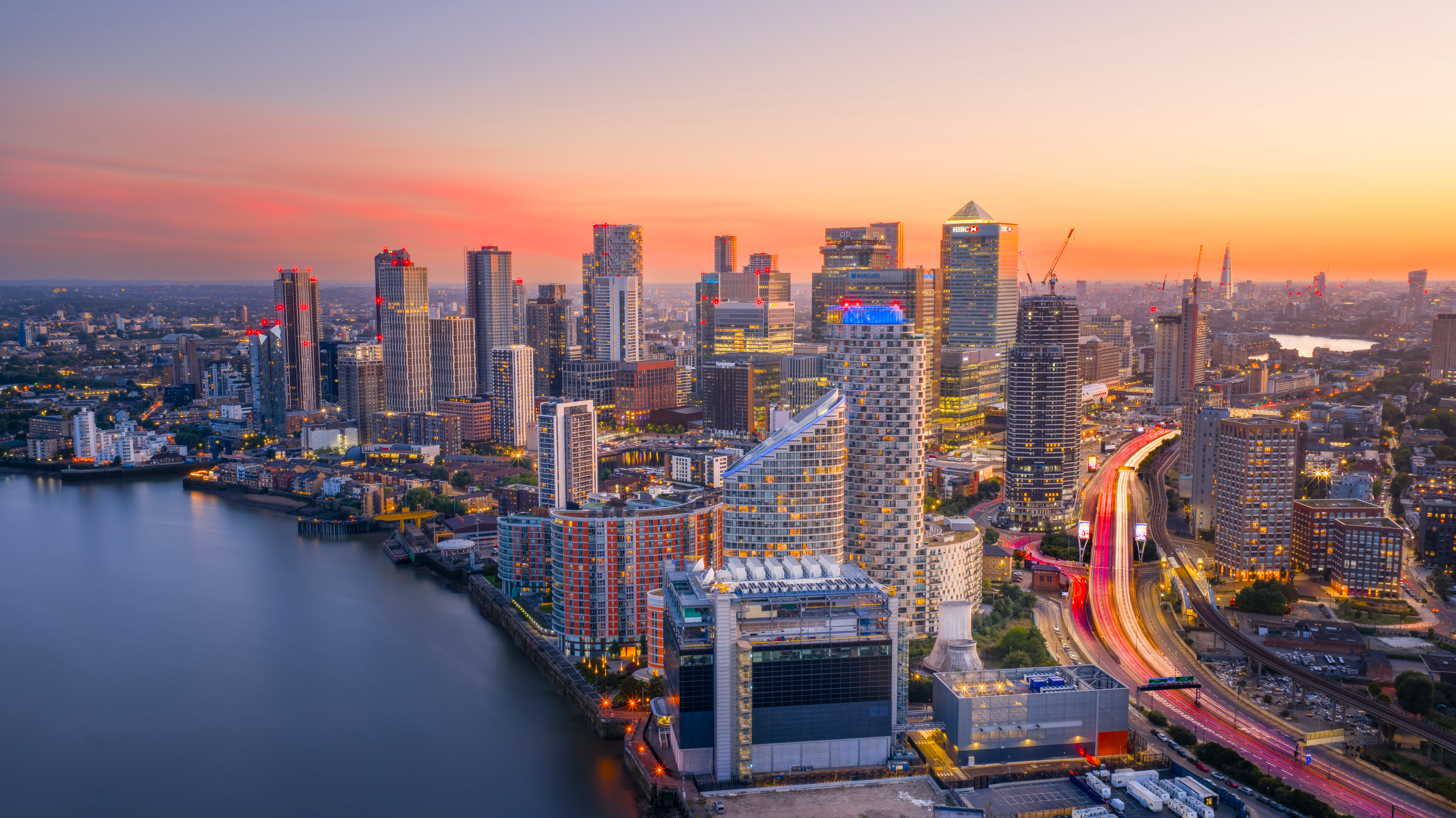 Canary Wharf skyline at sunset with river and highway HD Wallpaper