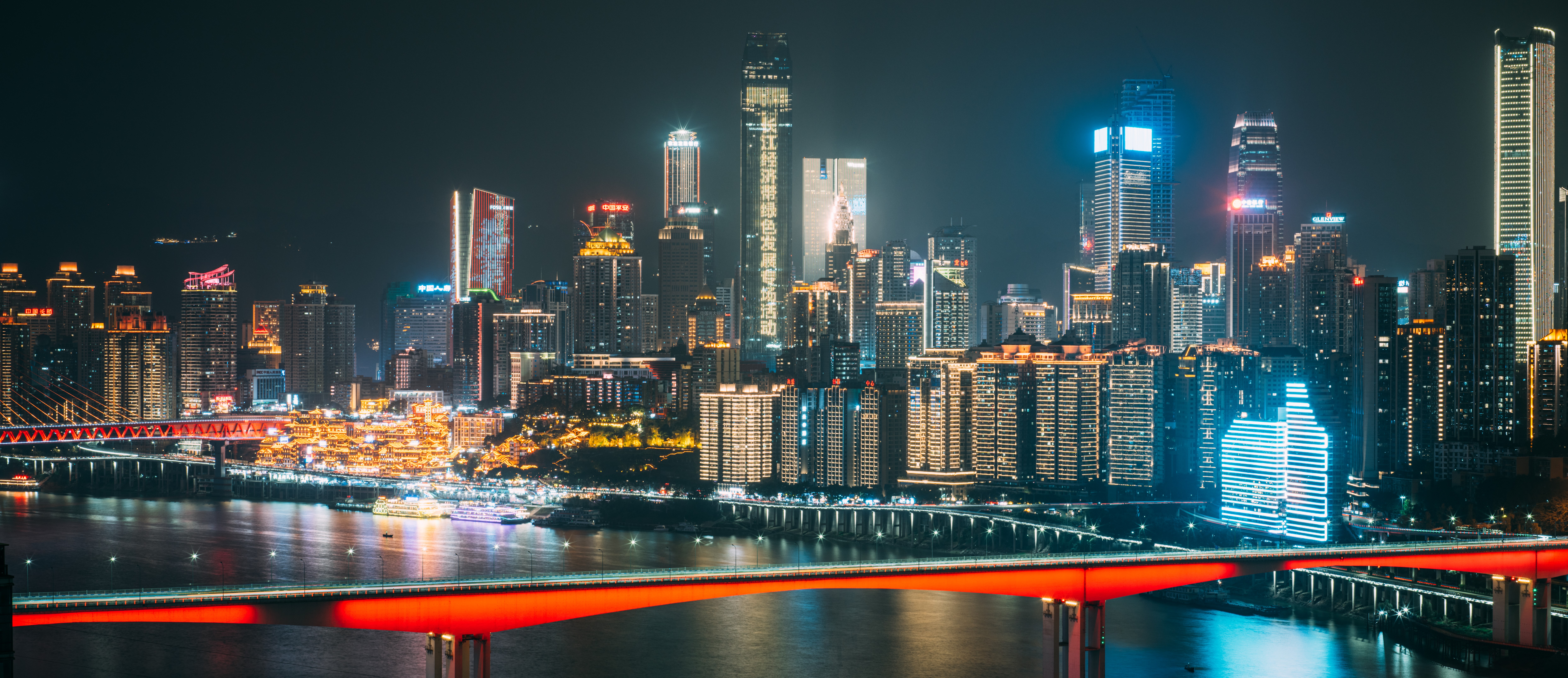 City skyline with river and bridge at night HD Wallpaper