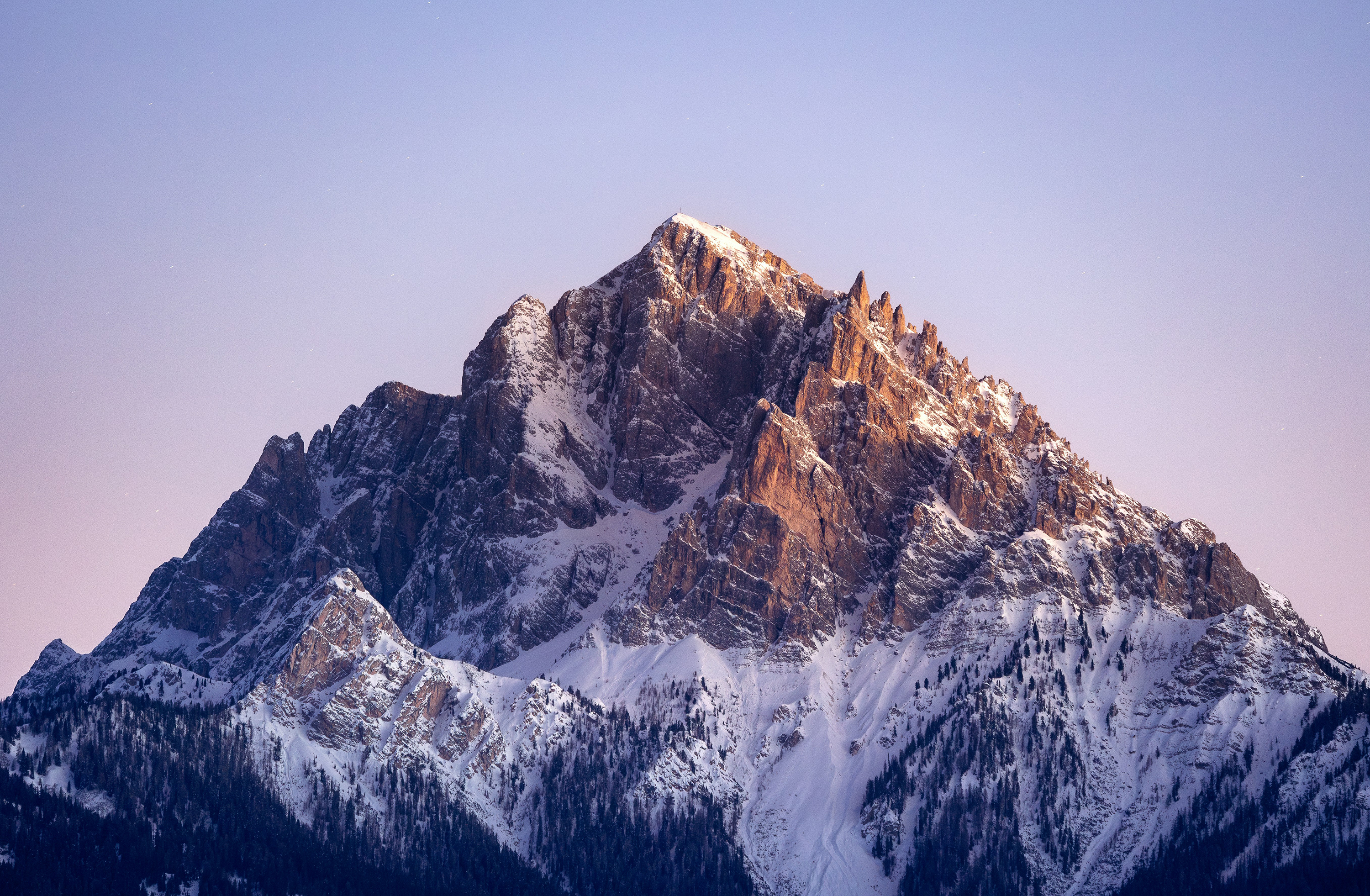 Snow-covered mountain peak at sunrise HD Wallpaper